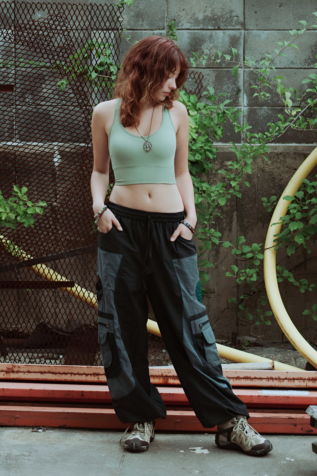 Model wearing boho-style harem pants in outdoor natural setting