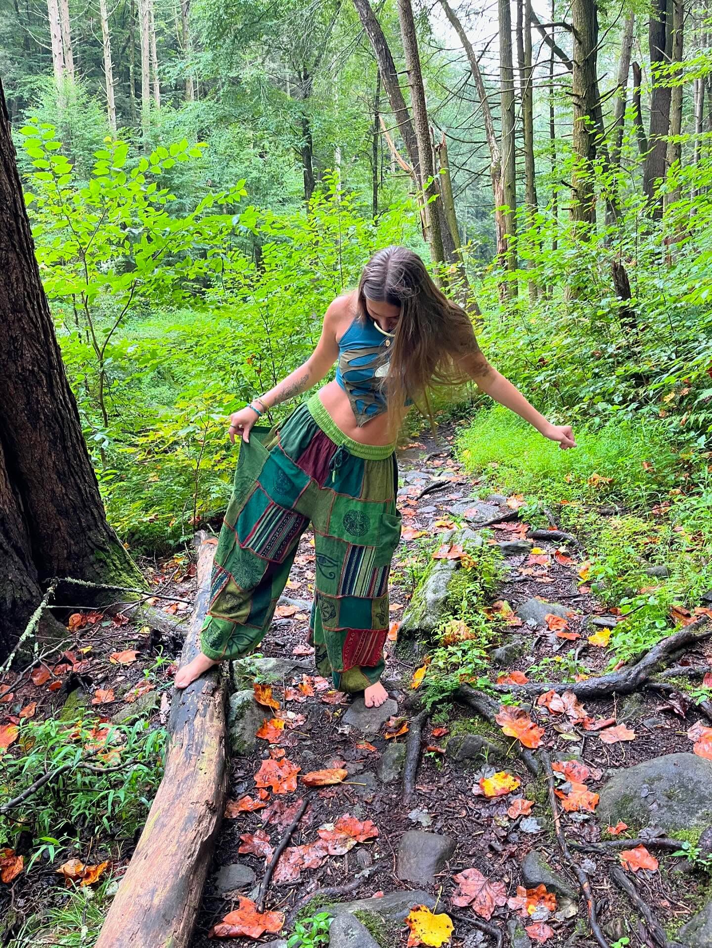 Model wearing handmade boho harem patchwork pants in an outdoor
