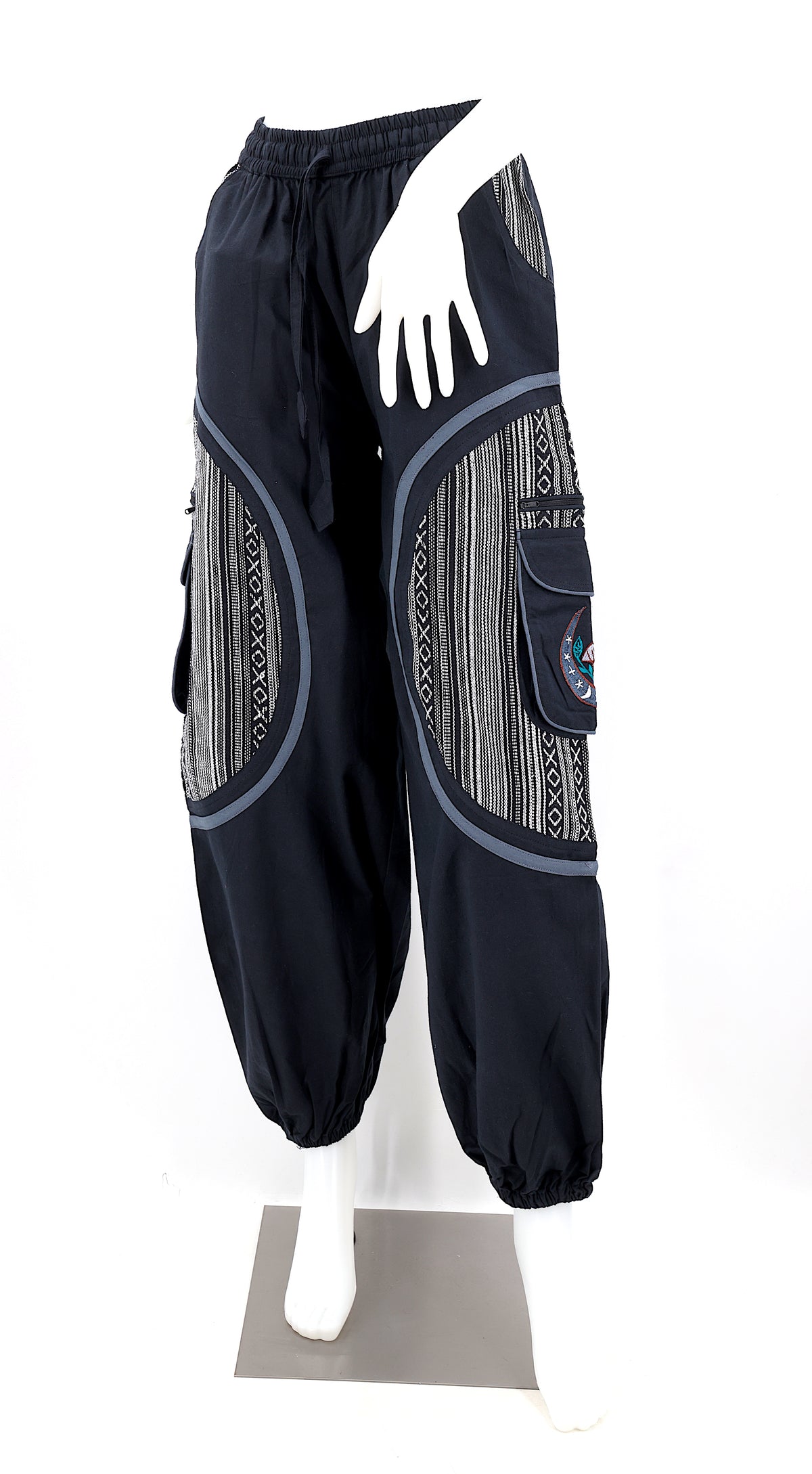 Front view of handmade moon and mushroom embroidered straight-leg harem pants