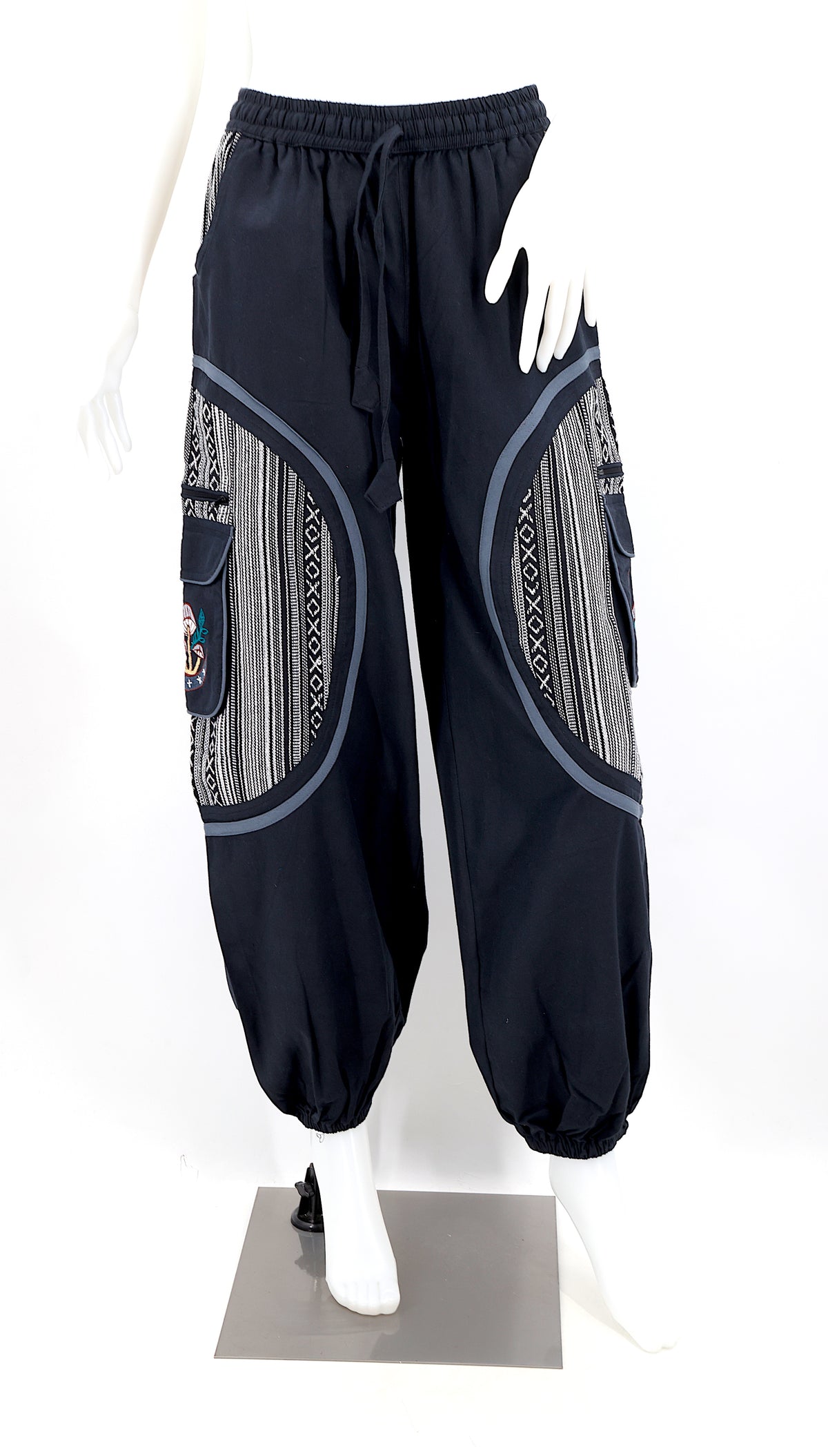 Front view of handmade moon and mushroom embroidered straight-leg harem pants