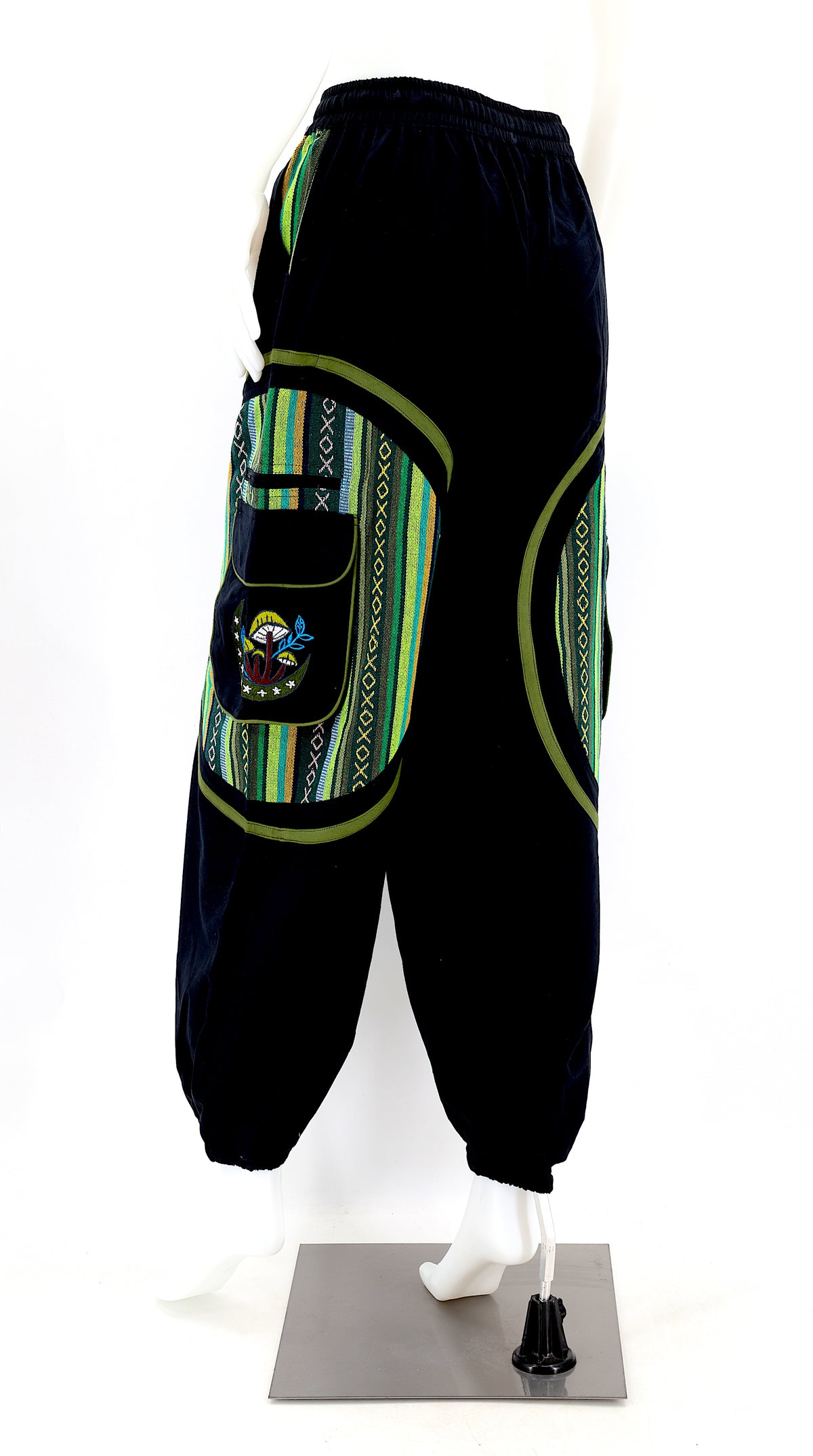 Back view of handmade moon and mushroom embroidered straight-leg harem pants