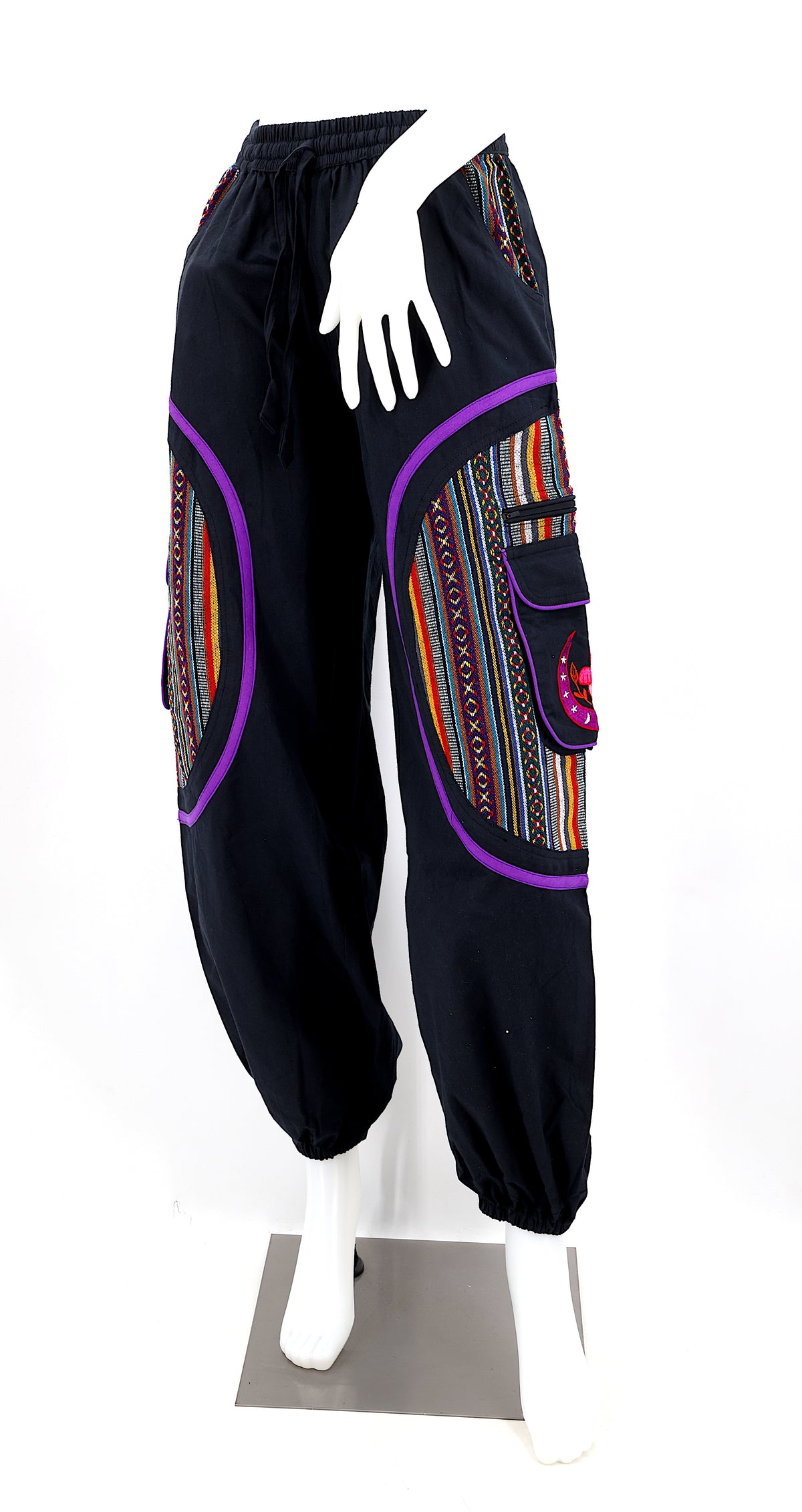 Front view of handmade moon and mushroom embroidered straight-leg harem pants