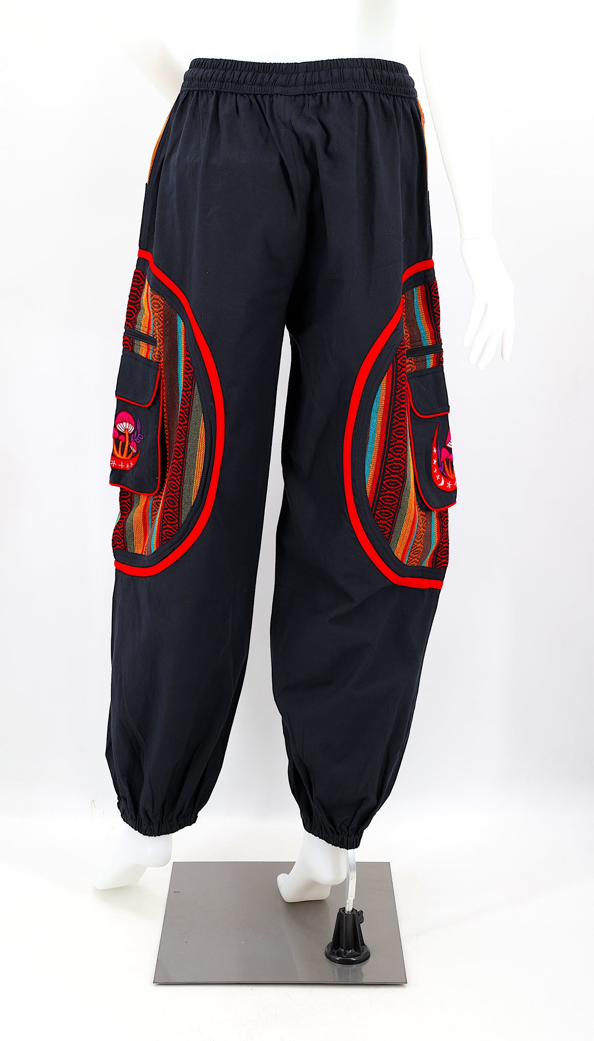 Back view of handmade moon and mushroom embroidered straight-leg harem pants