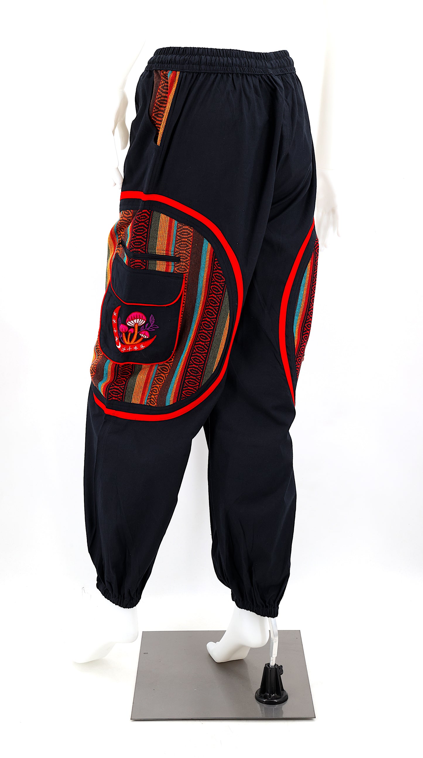 Back view of handmade moon and mushroom embroidered straight-leg harem pants