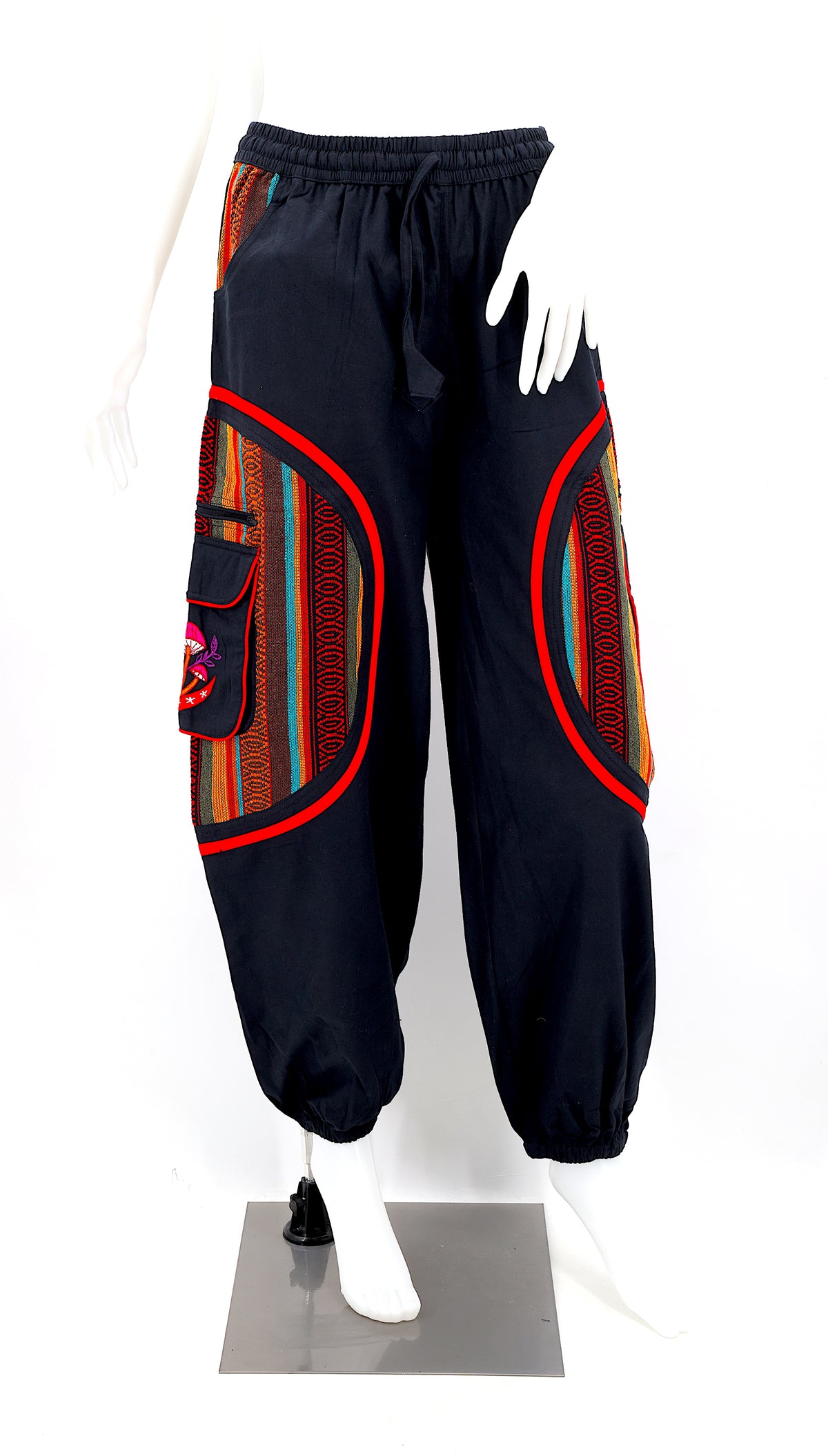 Front view of handmade moon and mushroom embroidered straight-leg harem pants