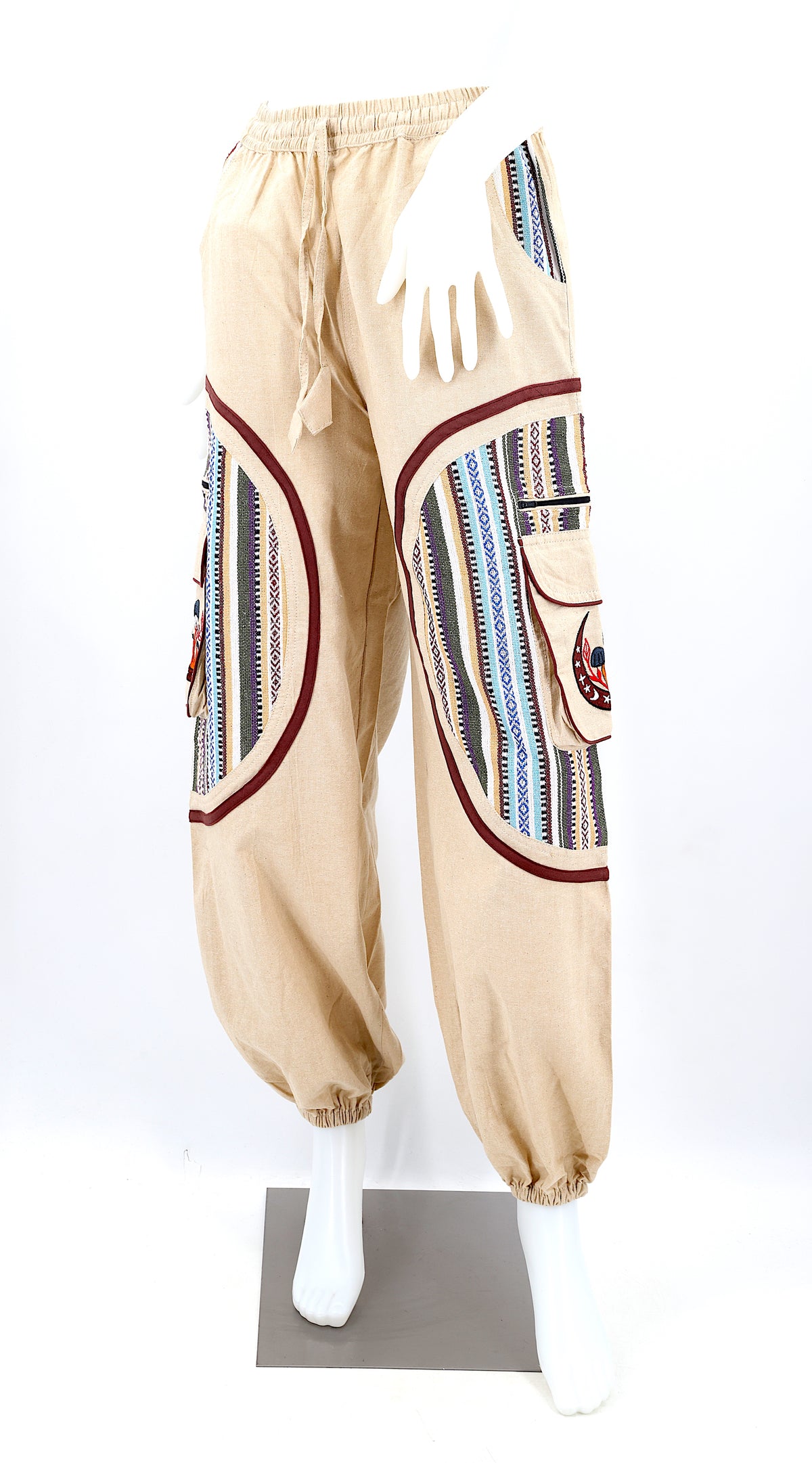 Front view of handmade moon and mushroom embroidered straight-leg harem pants