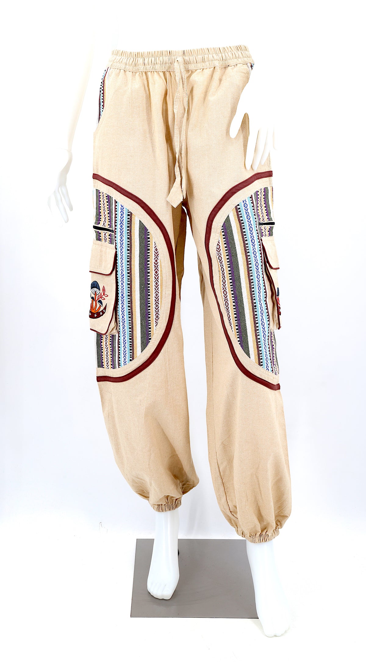Front view of handmade moon and mushroom embroidered straight-leg harem pants