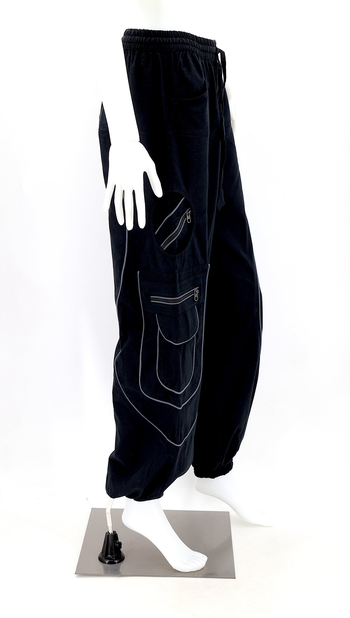 Side view showing relaxed fit and pocket detail of black boho harem trousers