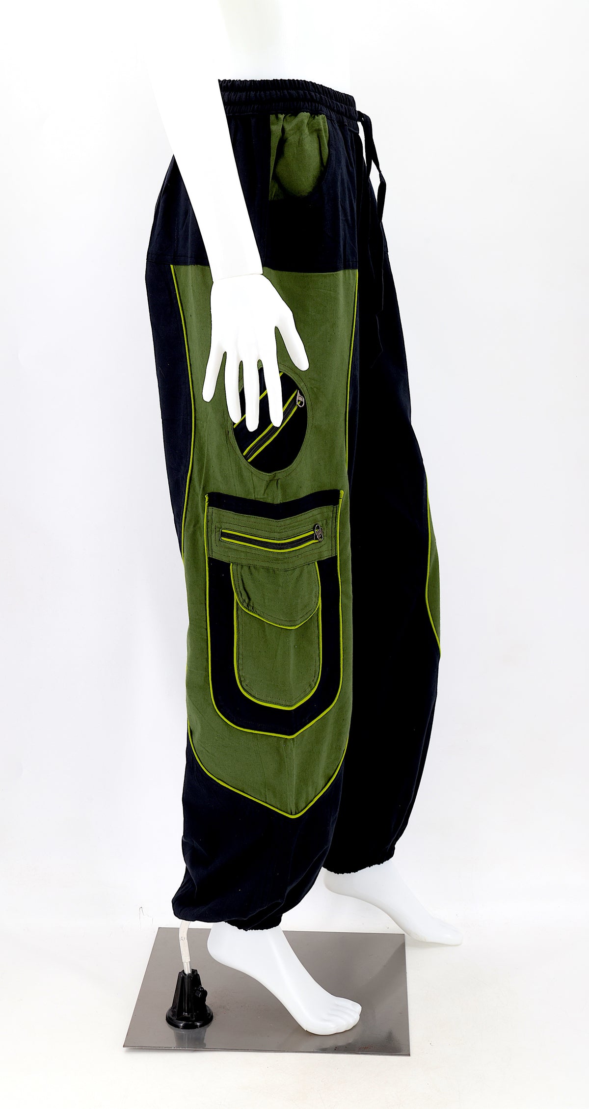 Right side view showing relaxed fit and pocket detail of black green boho harem trousers