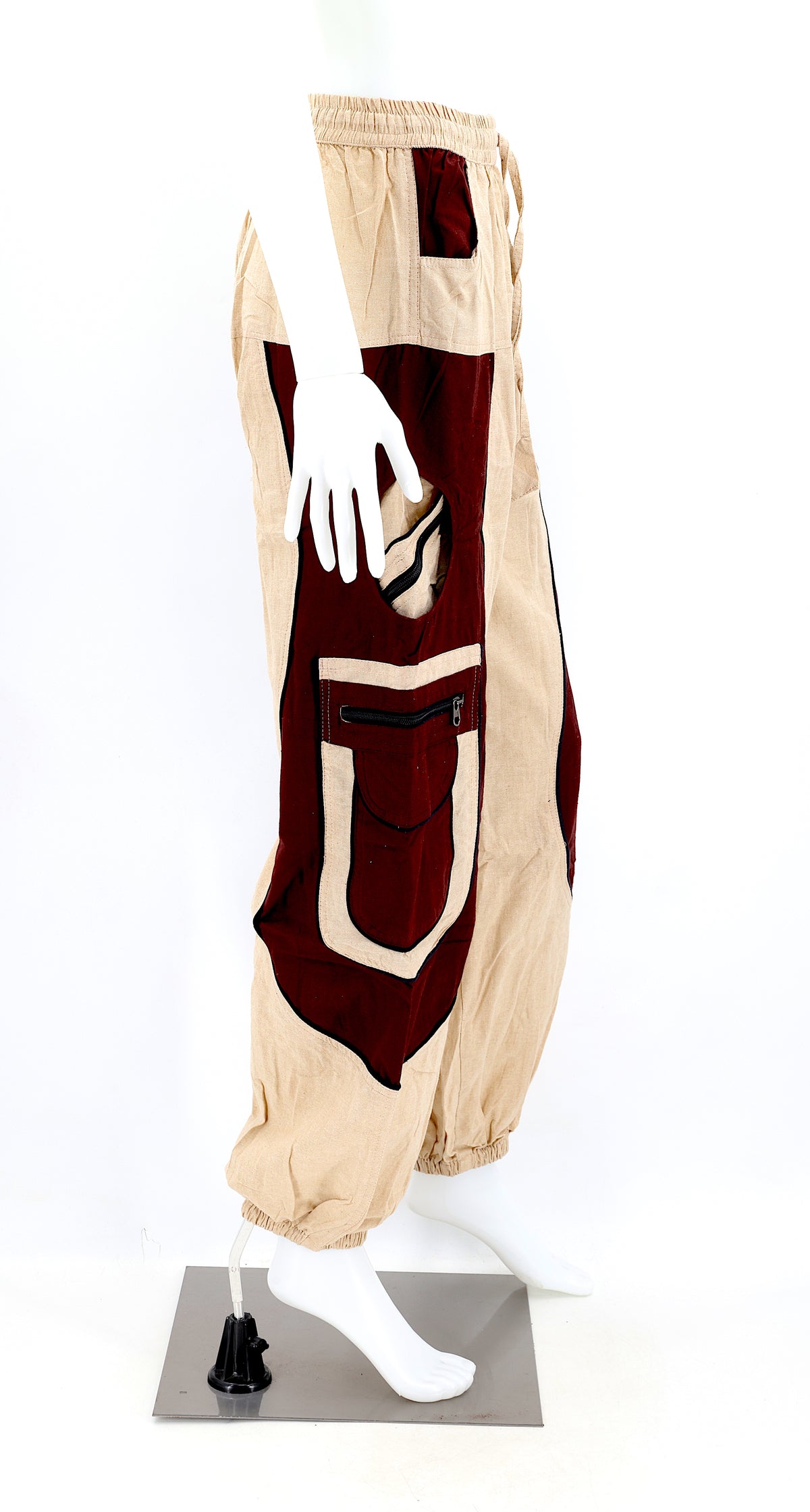 Side view showing relaxed fit and pocket detail of beige brown boho harem trousers