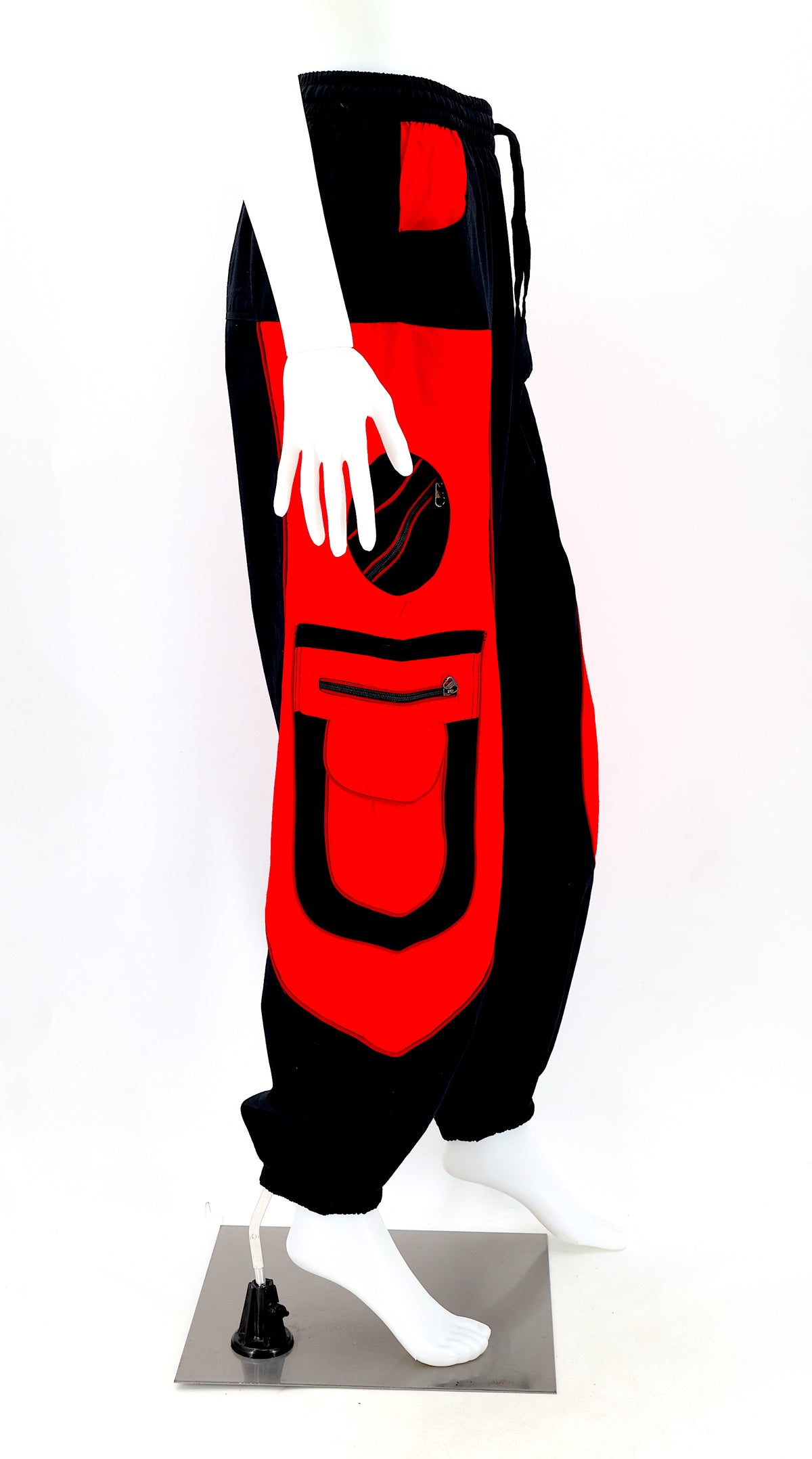 Right side view showing relaxed fit and pocket detail of black red boho harem trousers
