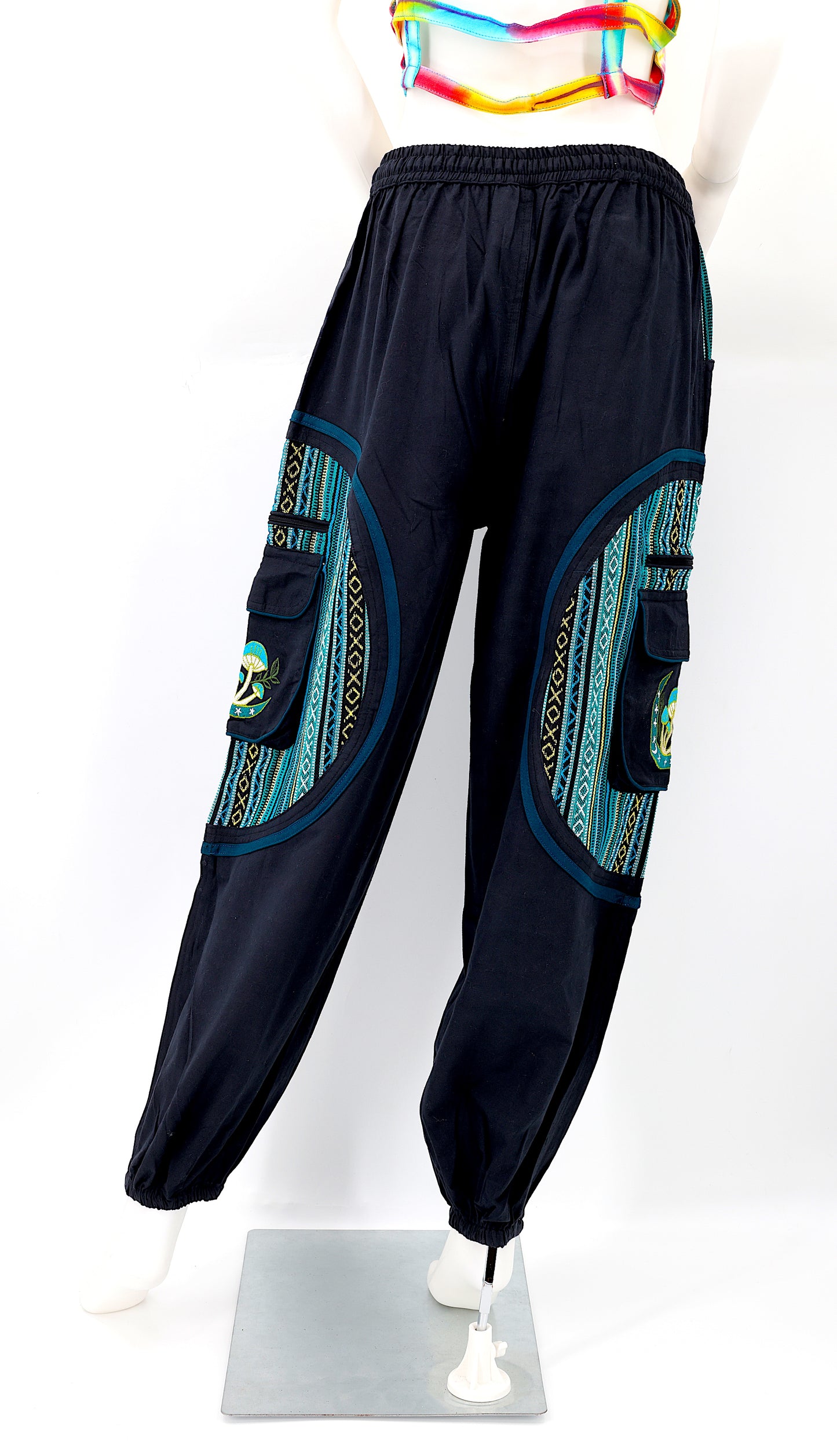 Back view of black and teal blue handmade moon and mushroom embroidered straight-leg harem pants
