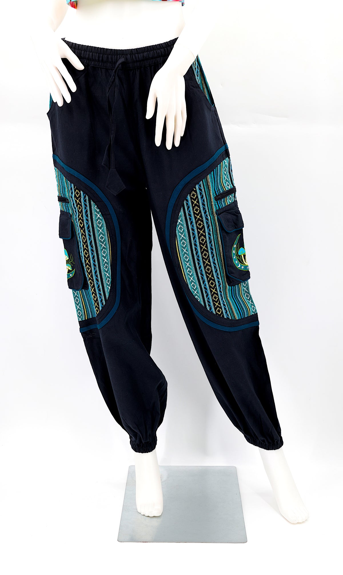 Front view of handmade moon and mushroom embroidered straight-leg harem pants