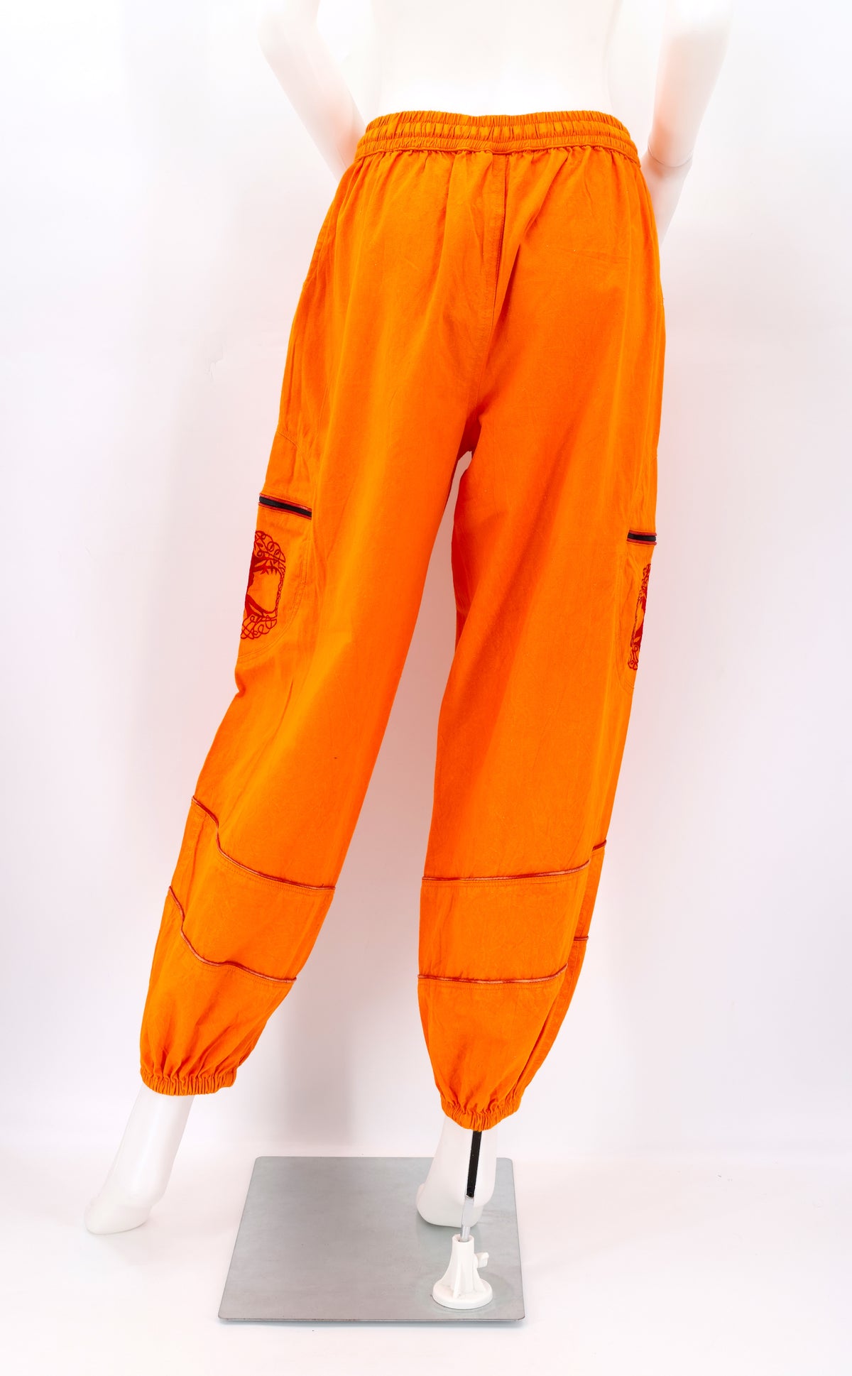 Back view of orange handmade Tree of Life embroidered straight-leg harem pants