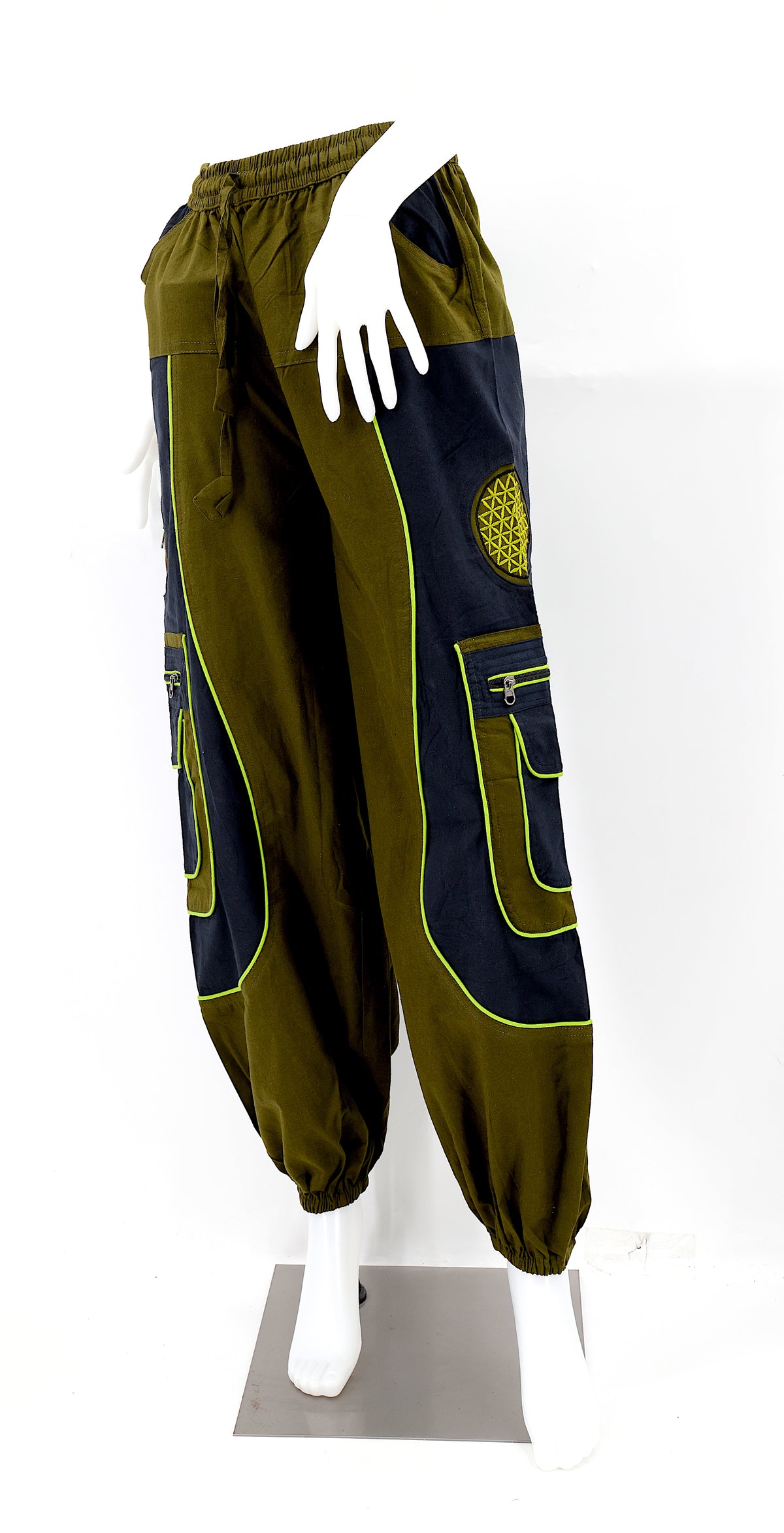 Close-up of camo green embroidered Flower of Life symbol on handmade trousers