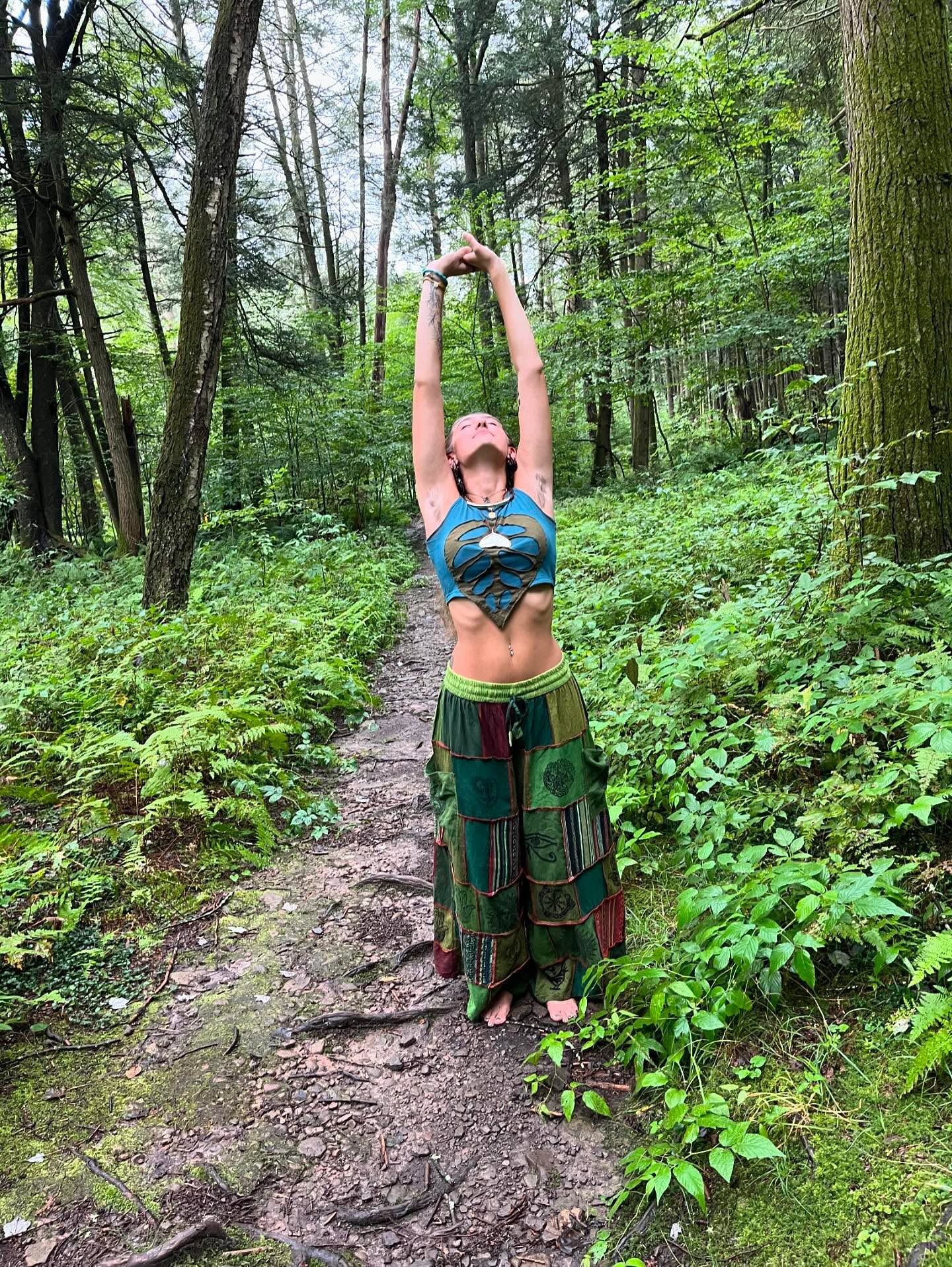 Model wearing handmade boho harem patchwork pants in an outdoor
