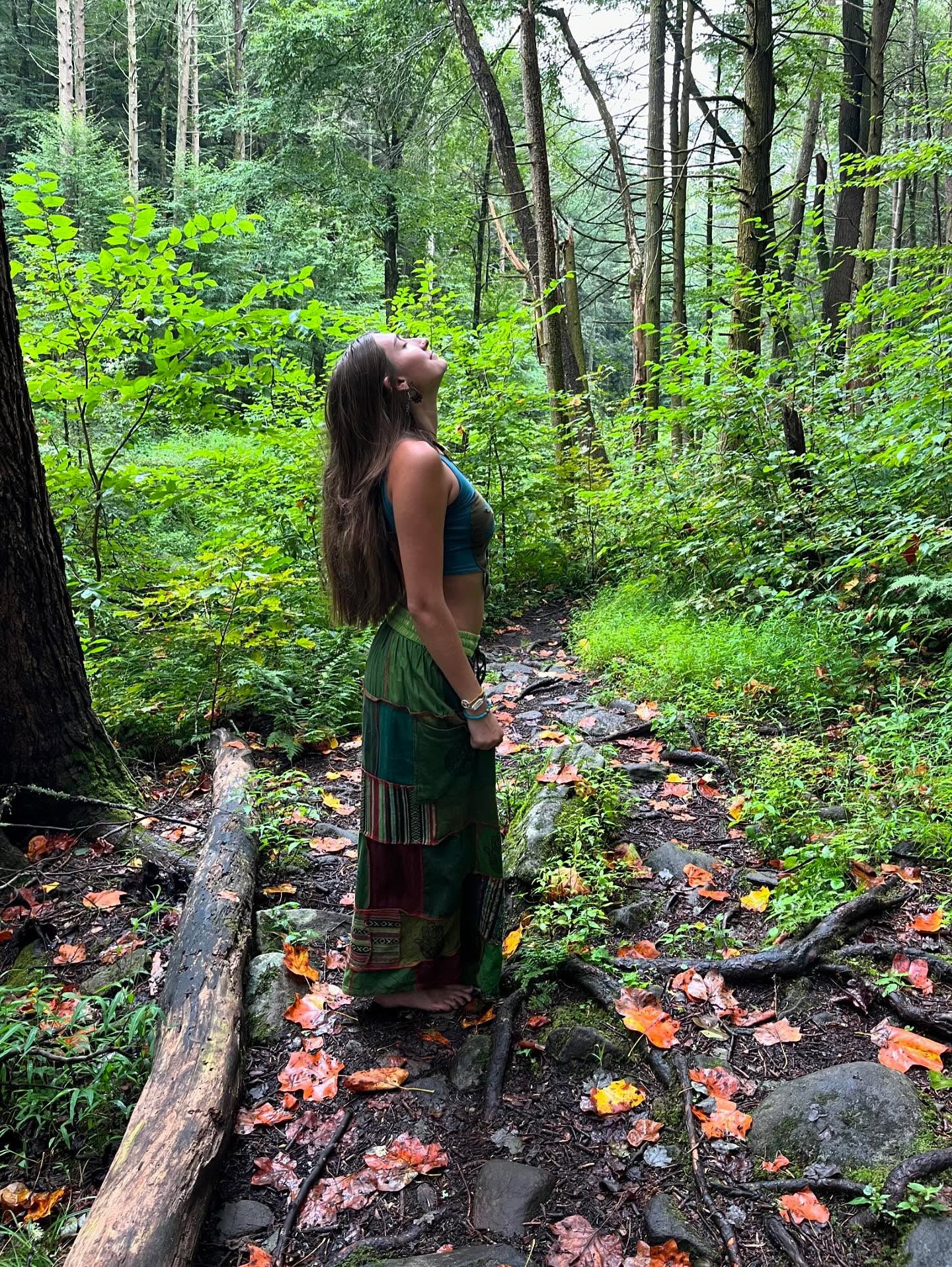 Model wearing handmade boho harem patchwork pants in an outdoor