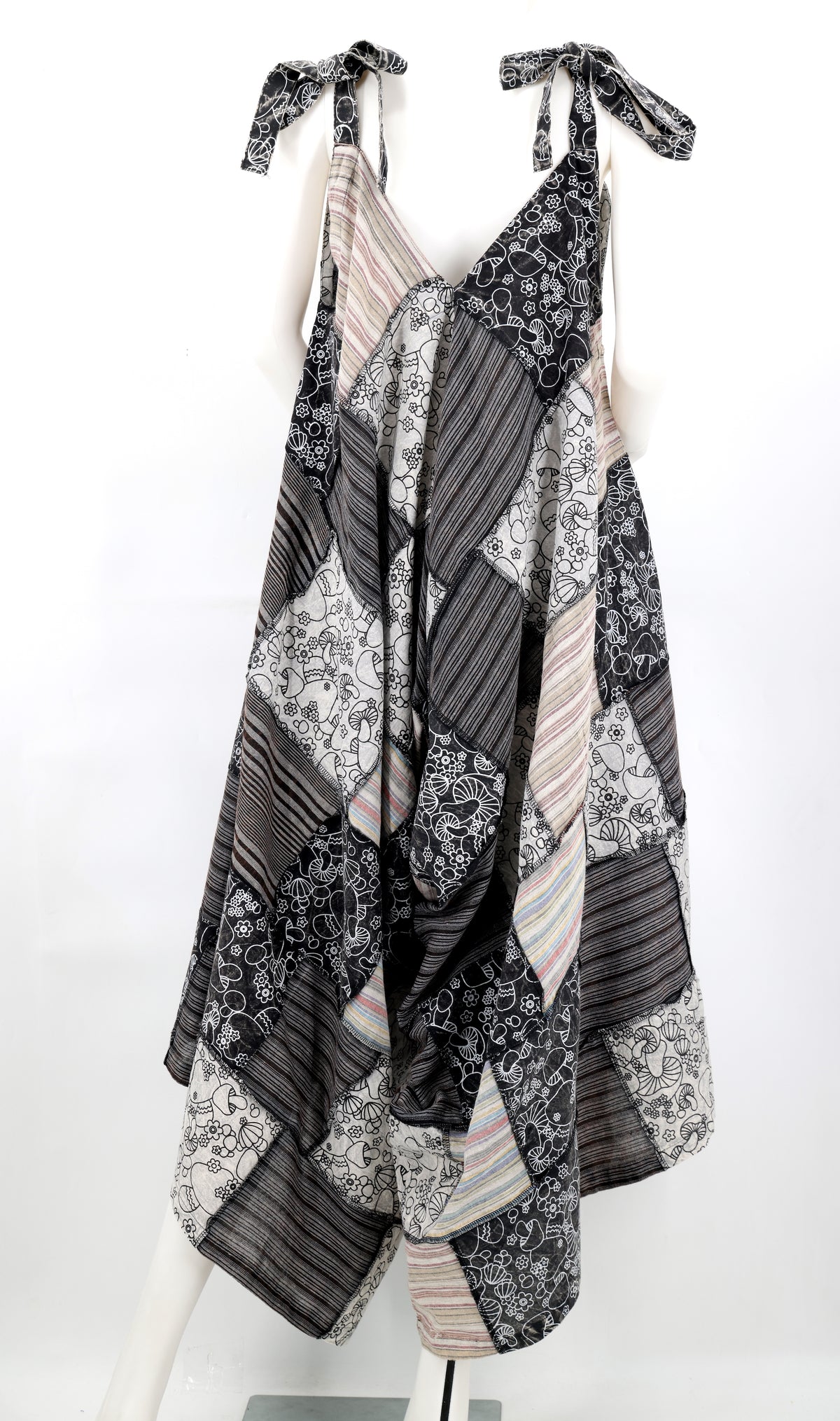 Black and white patterned dress on a mannequin against a white background