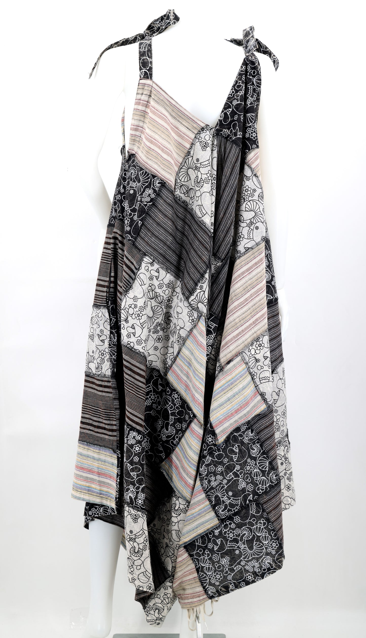 Patterned scarf draped over a mannequin on a white background