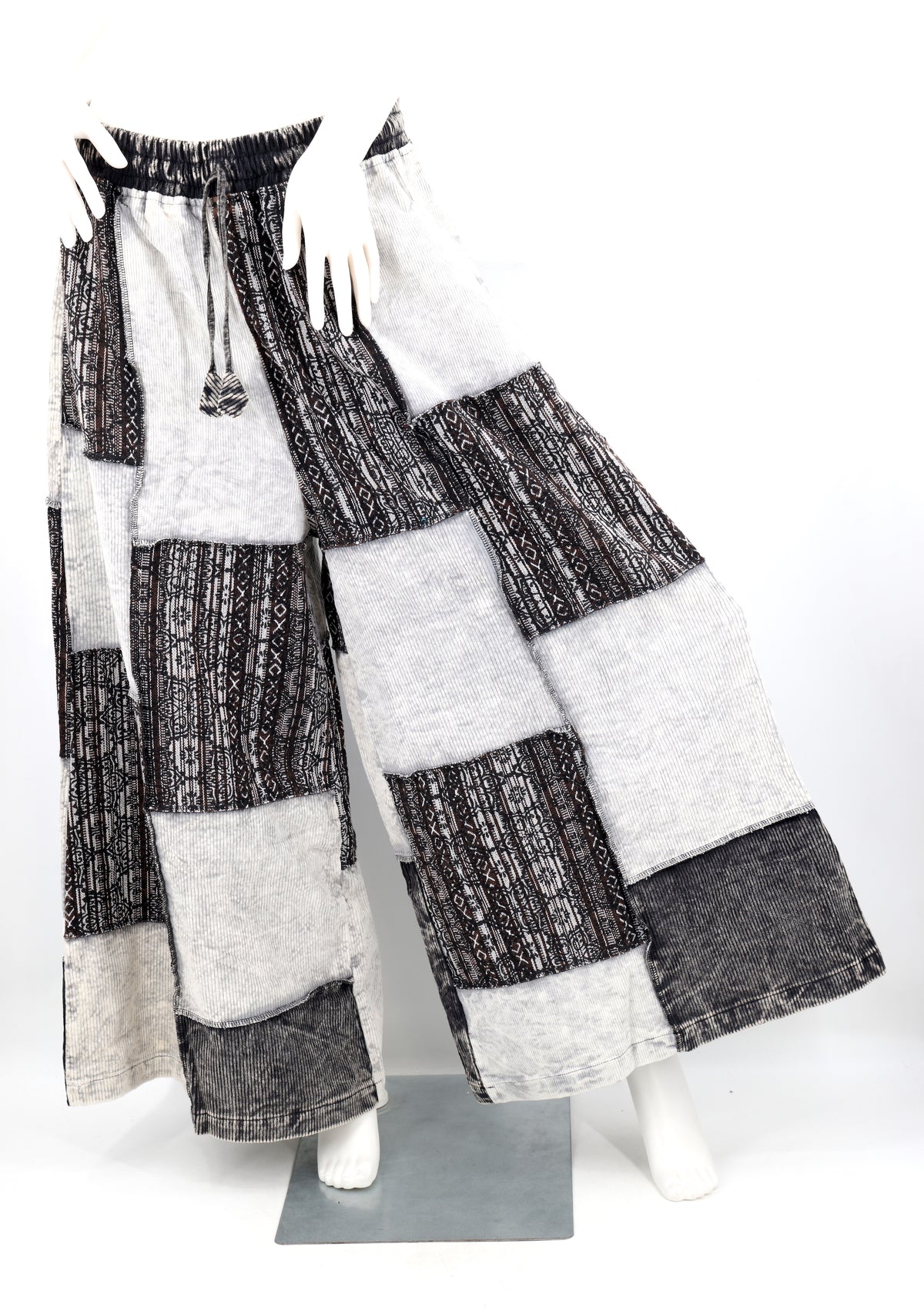Patchwork pants on a mannequin against a white background