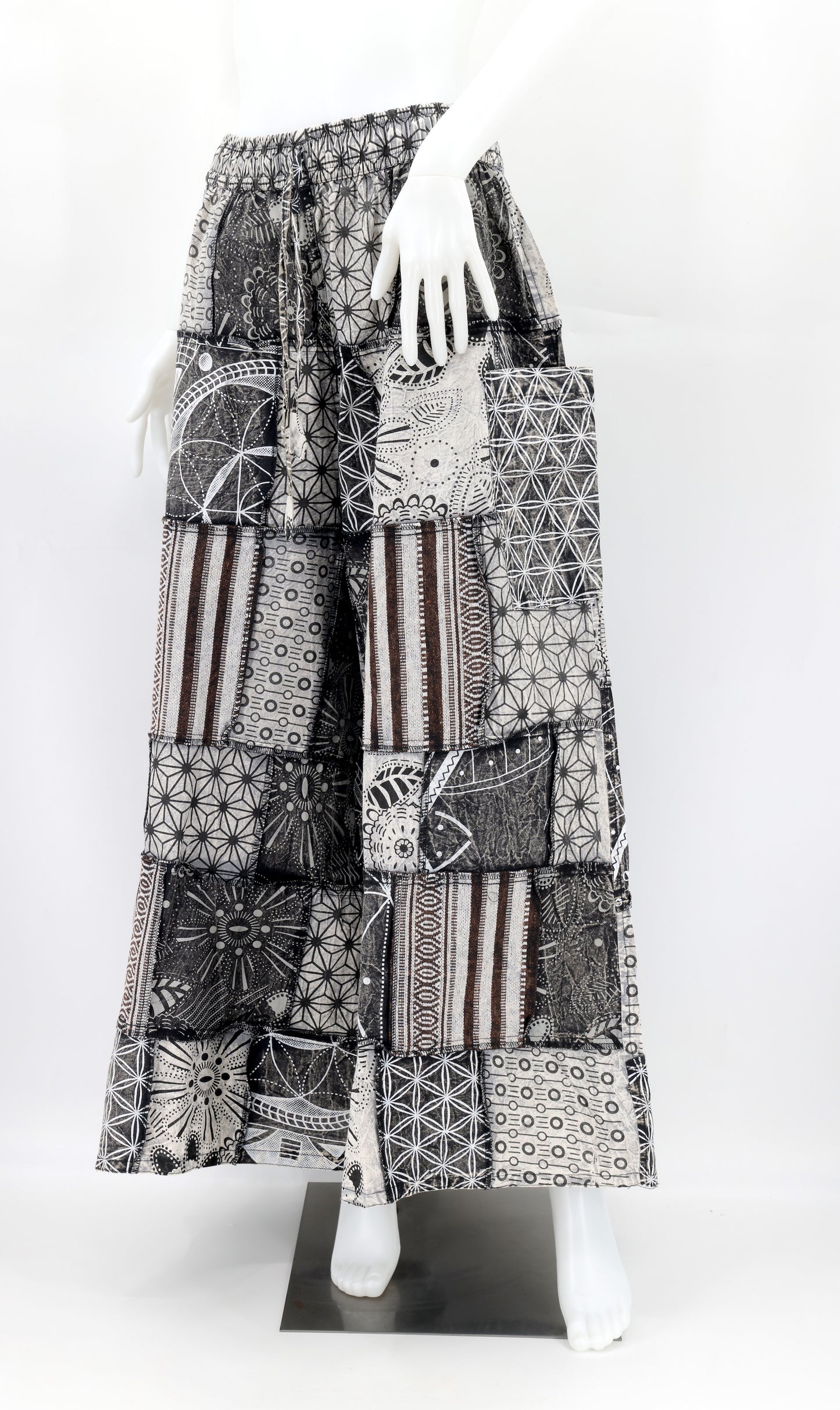 Detailed view of handwoven cotton fabric with colorful Aztec-style geometric patchwork