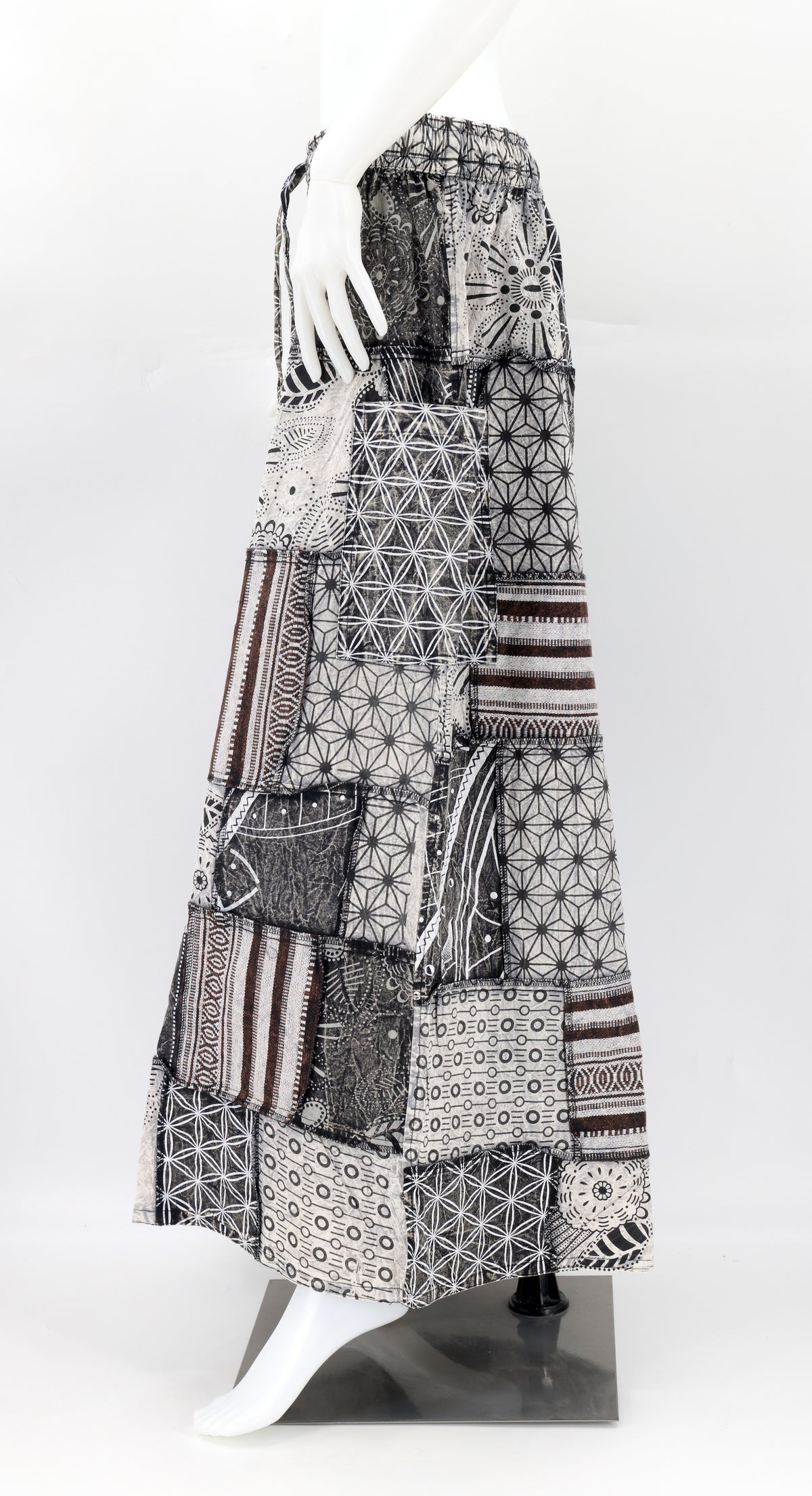 Side profile of bohemian harem trousers featuring vibrant geometric patterns and spacious side pocket
