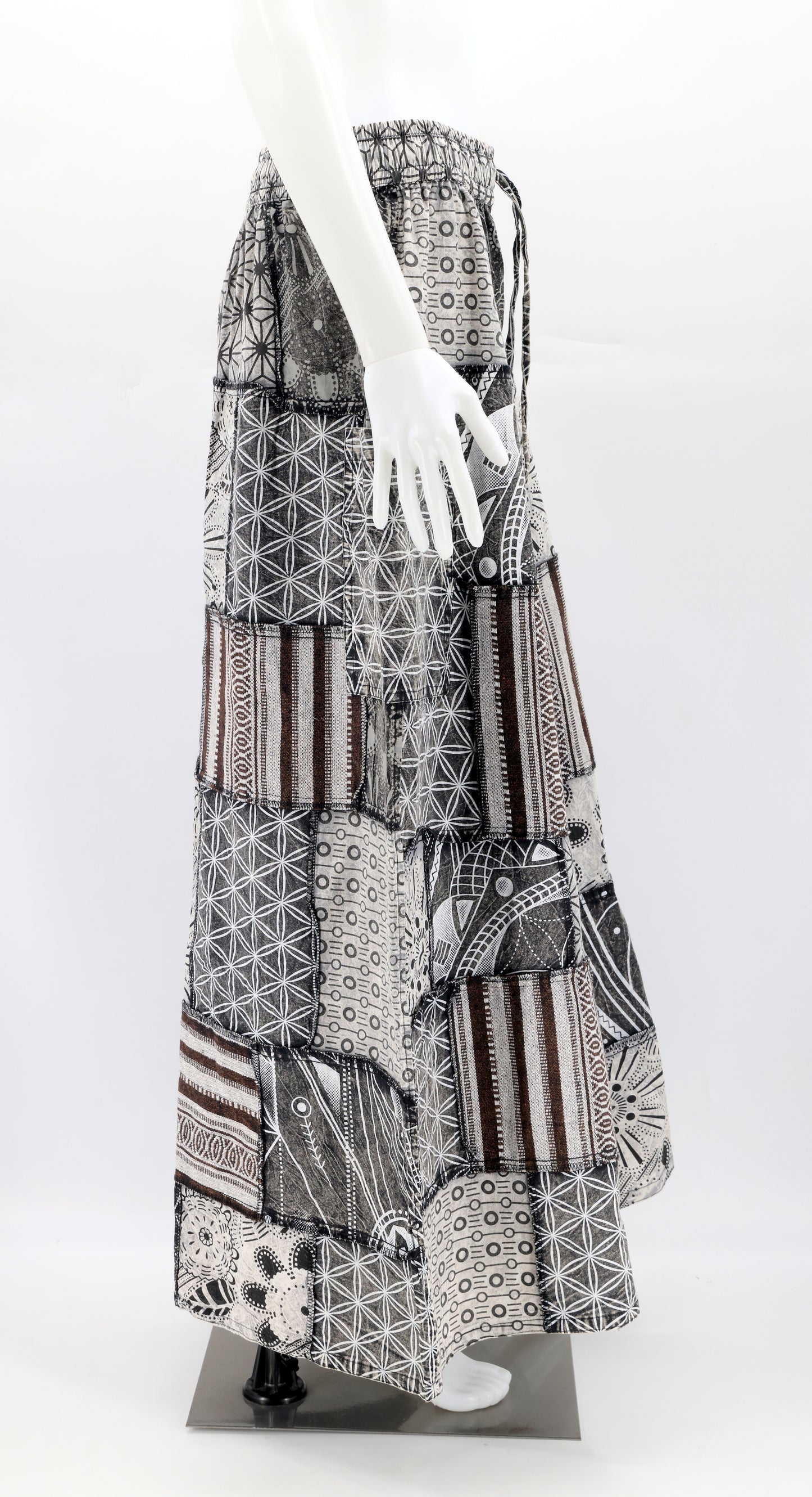 Side profile of bohemian harem trousers featuring vibrant geometric patterns and spacious side pocket