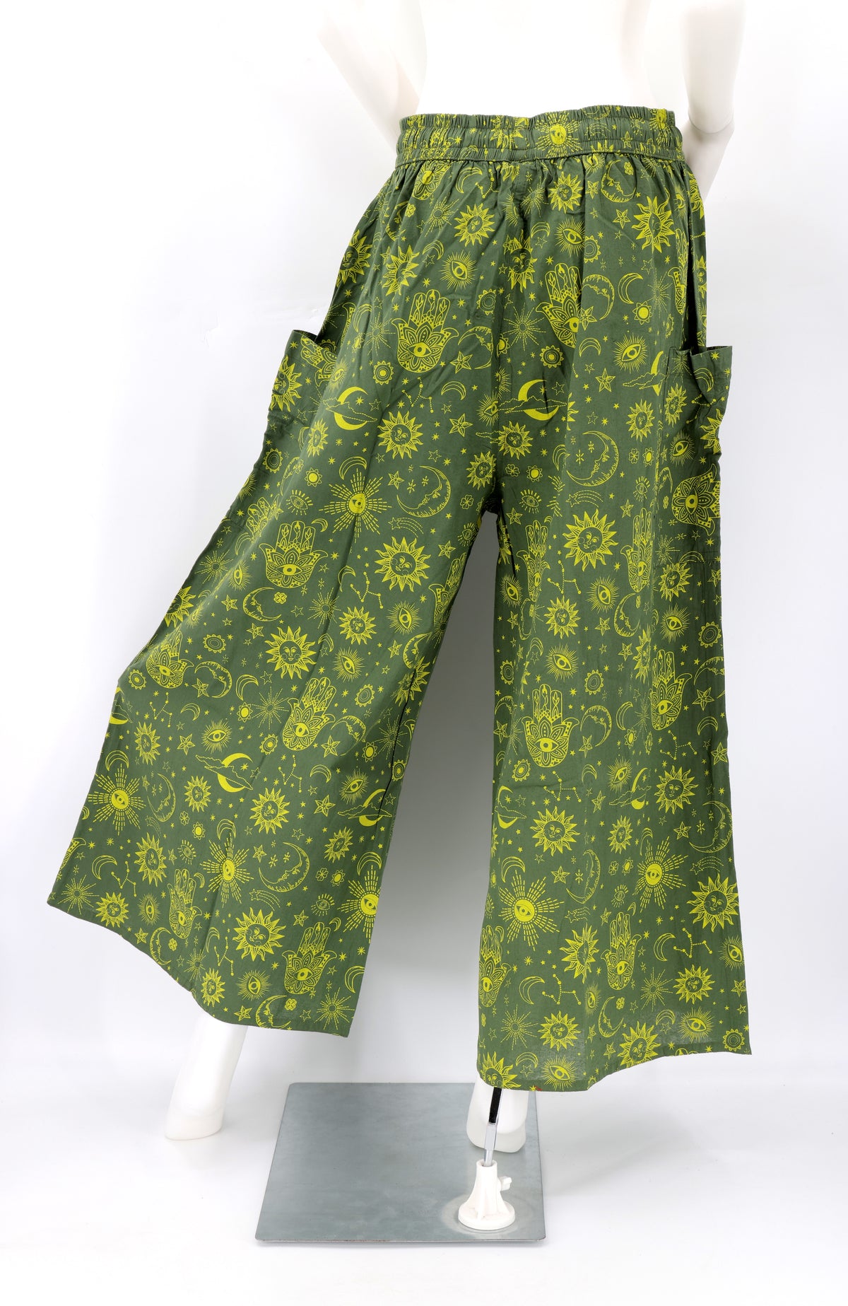 Back angle of wide-leg harem pants with celestial designs and flowy cotton fabric