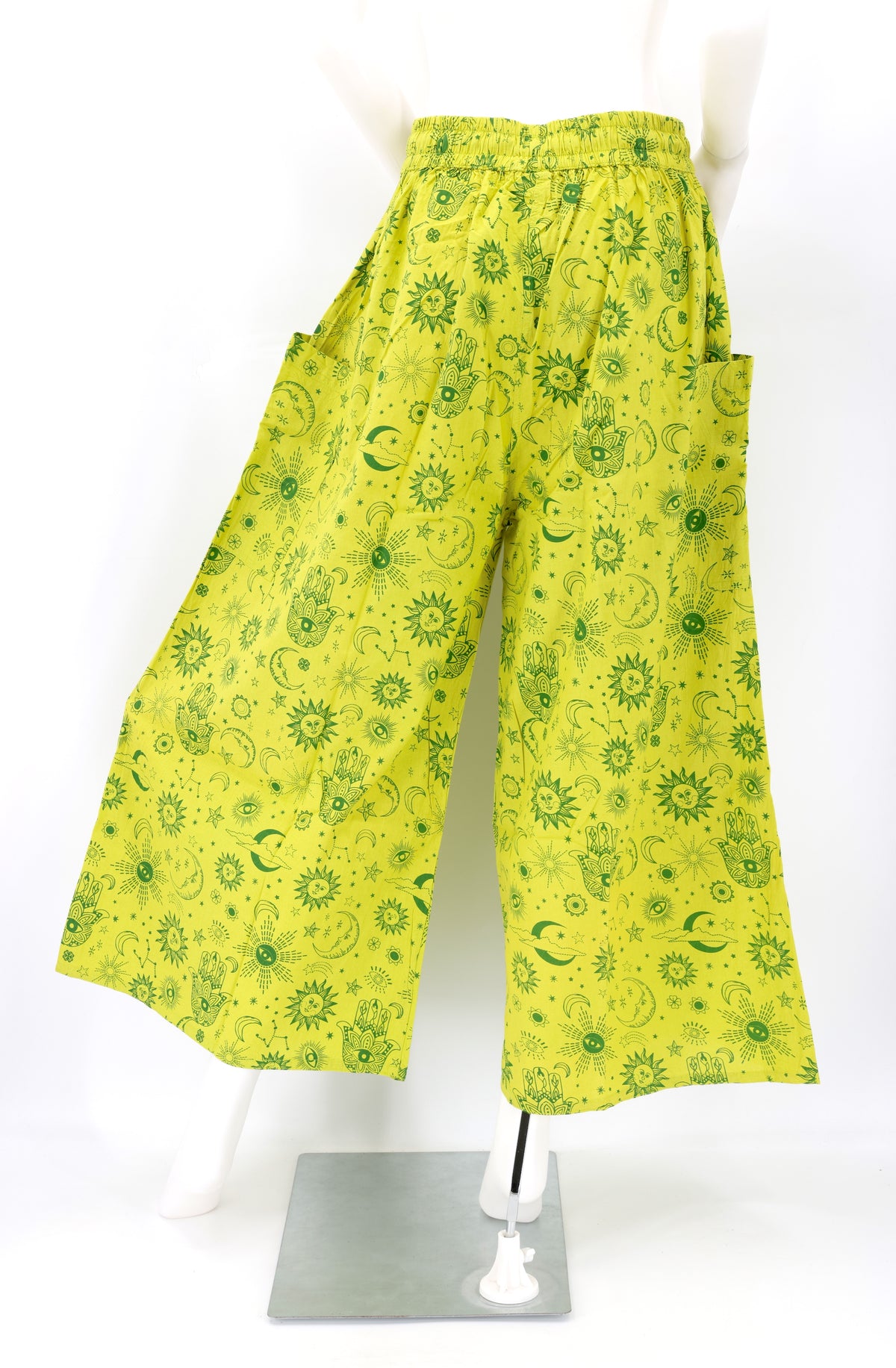 Back angle of wide-leg harem pants with celestial designs and flowy cotton fabric