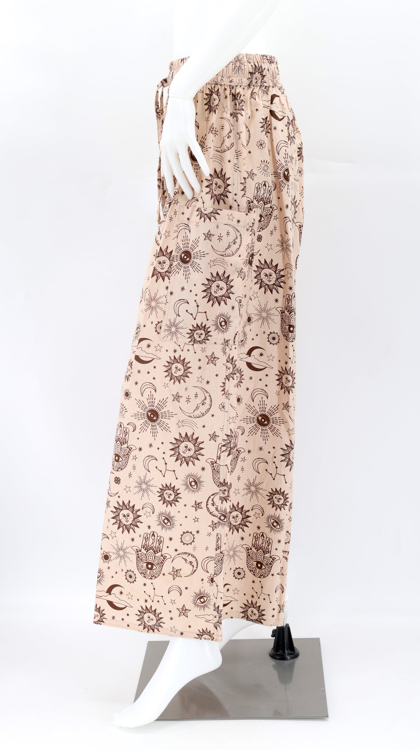 Side view of celestial print harem trousers with deep pocket and relaxed bohemian fit