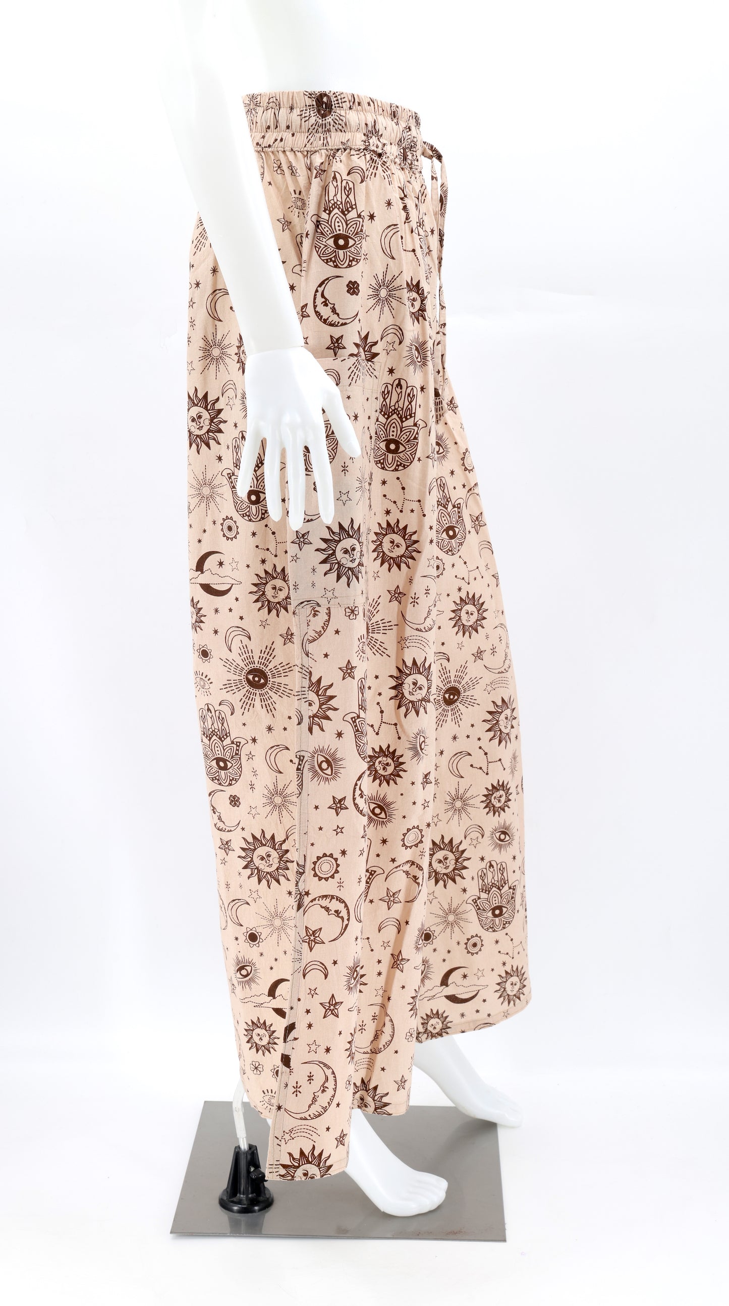 Side view of celestial print harem trousers with deep pocket and relaxed bohemian fit