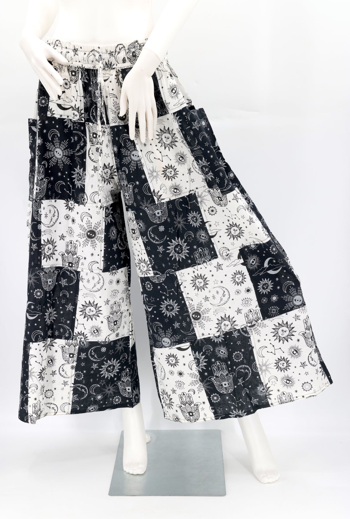 Front view of handmade celestial print wide-leg patchwork harem pants in natural cotton