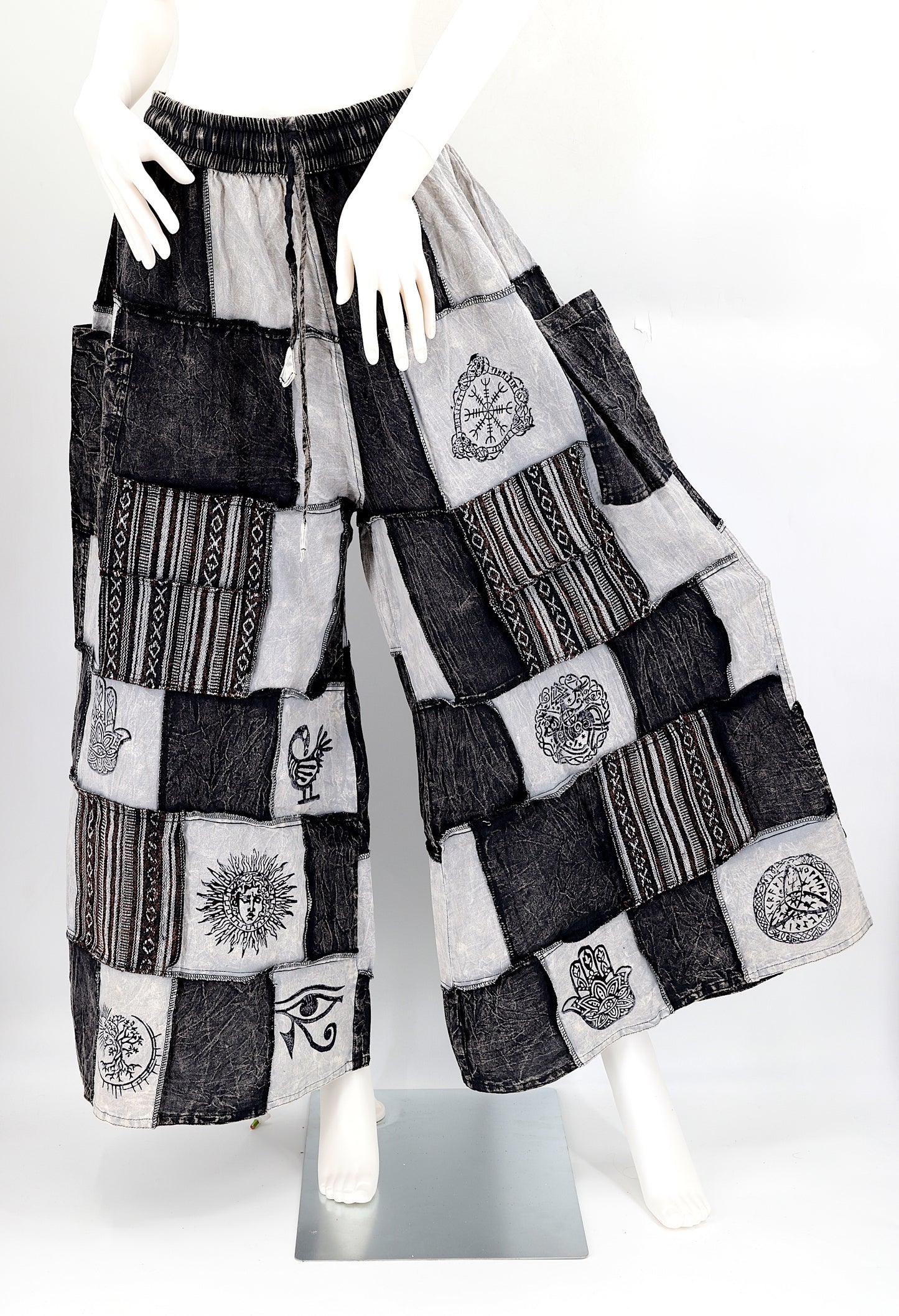 Bohemian harem pants with Old Gods symbolic patchwork and wide-leg design, handmade from natural cotton