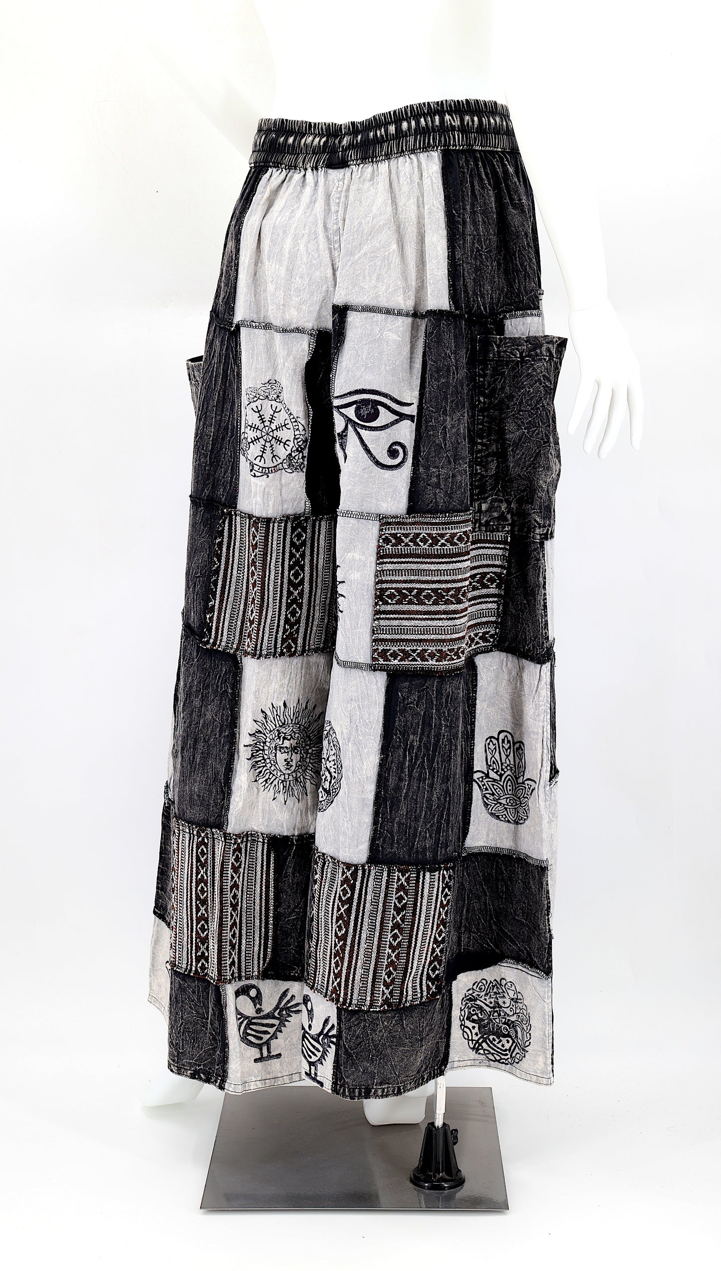 Back view of wide-leg cotton harem pants featuring ancient symbol designs