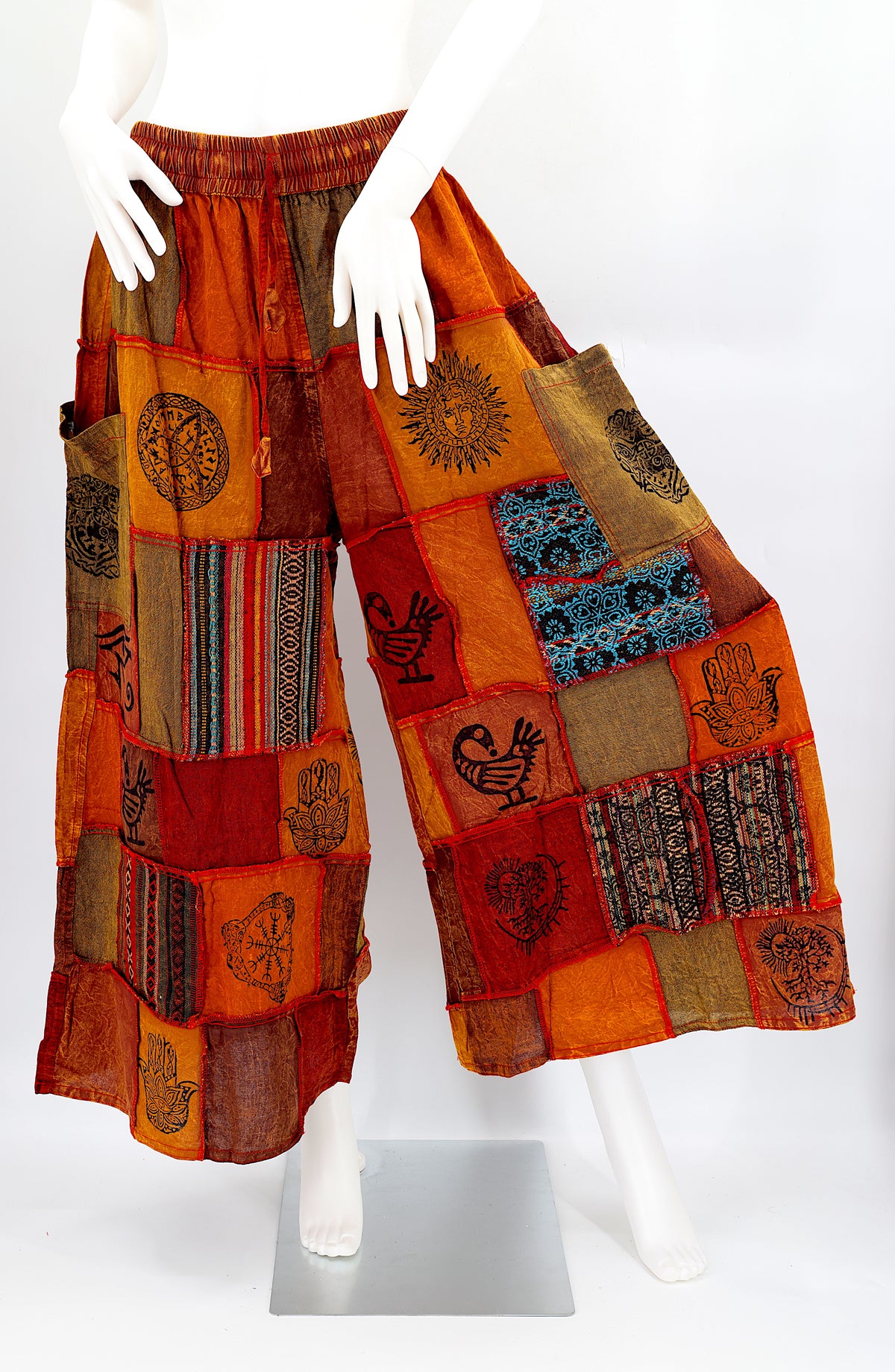 Bohemian harem pants with Old Gods symbolic patchwork and wide-leg design, handmade from natural cotton