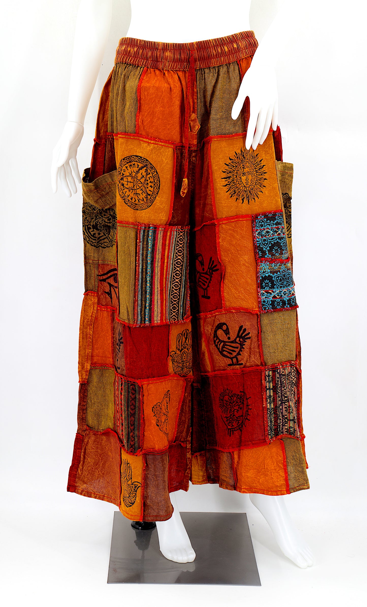 Bohemian harem pants with Old Gods symbolic patchwork and wide-leg design, handmade from natural cotton