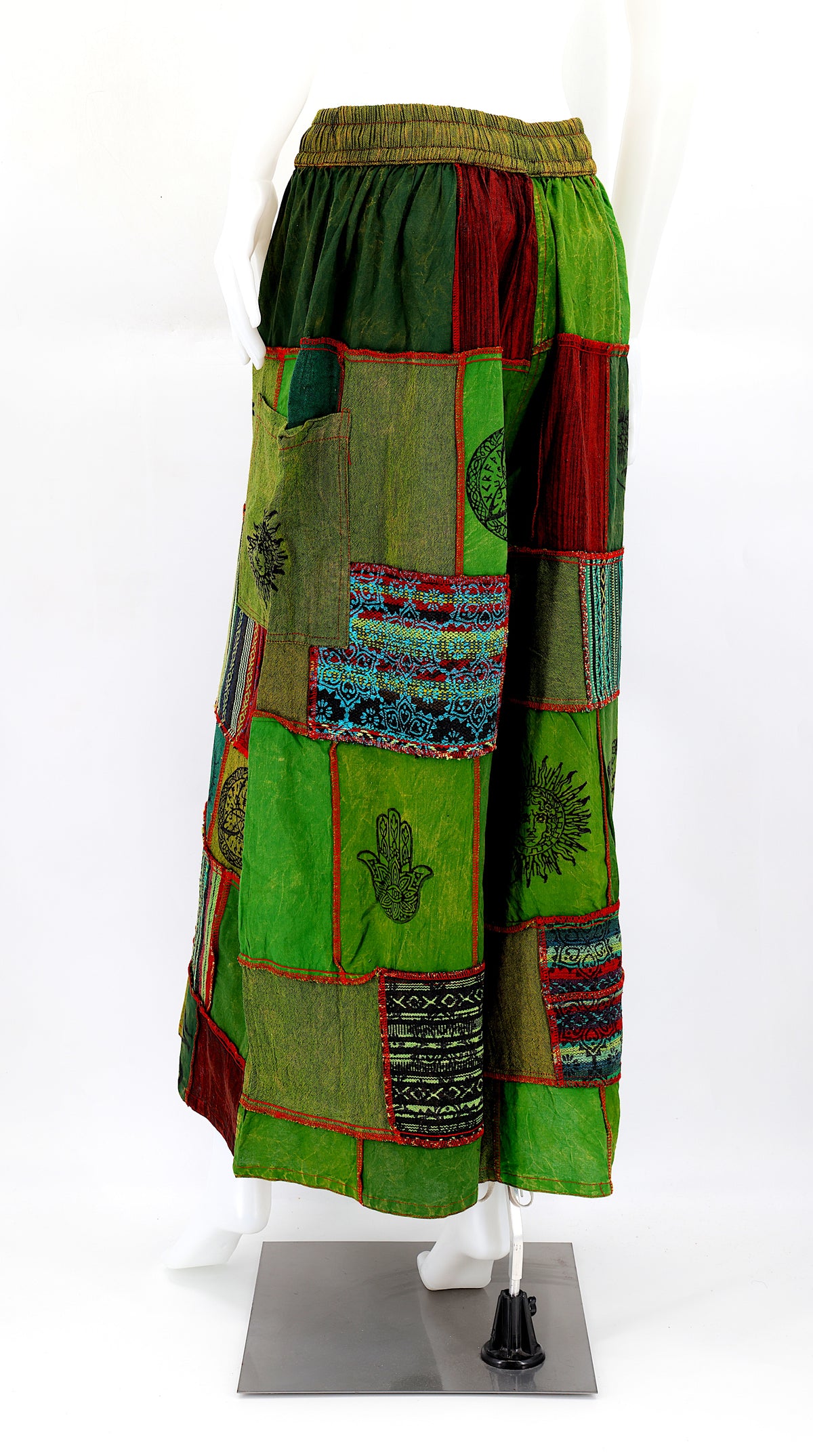 Back view of wide-leg cotton harem pants featuring ancient symbol designs