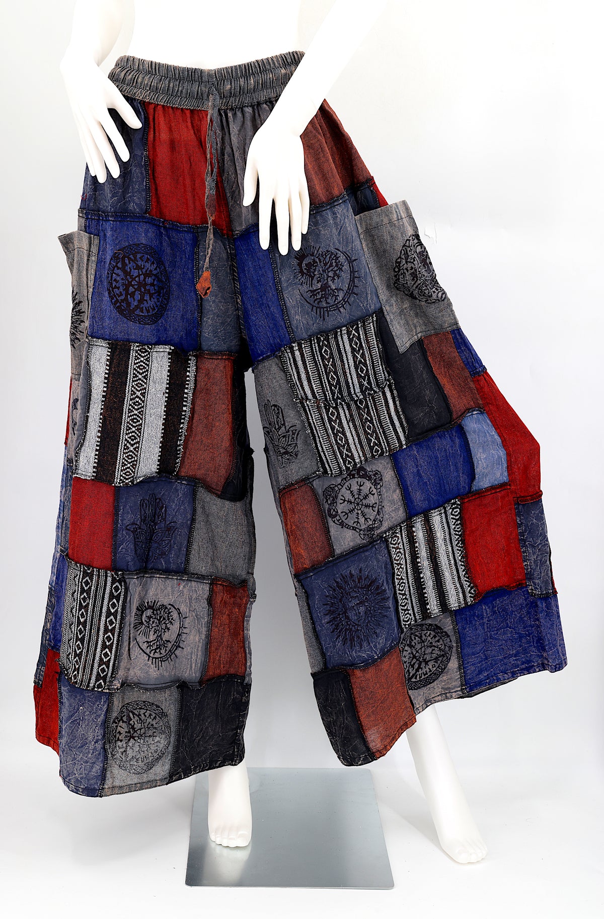 Bohemian harem pants with Old Gods symbolic patchwork and wide-leg design, handmade from natural cotton