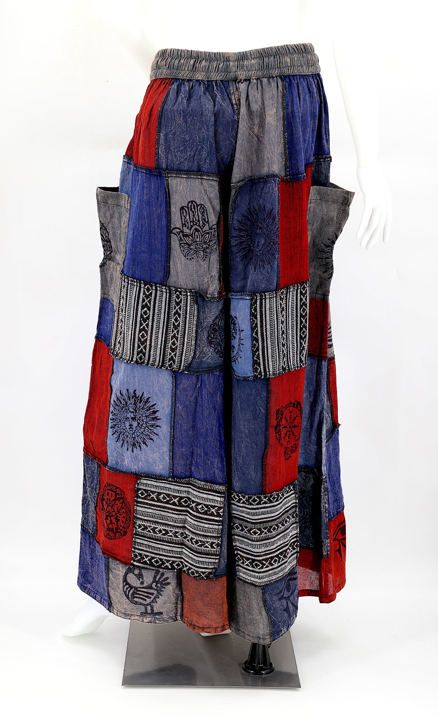 Back view of wide-leg cotton harem pants featuring ancient symbol designs