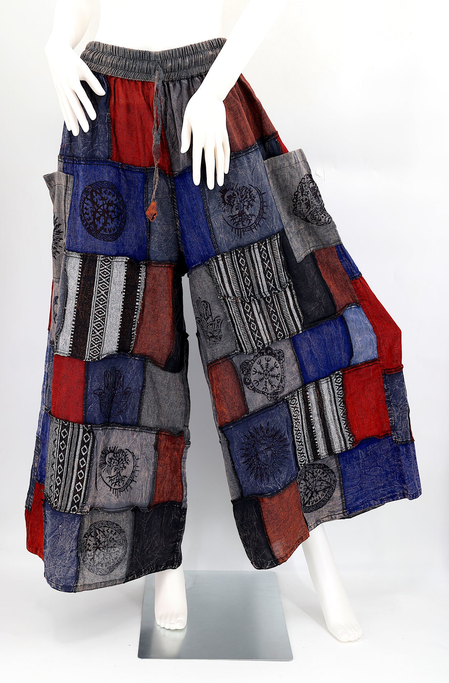 Bohemian harem pants with Old Gods symbolic patchwork and wide-leg design, handmade from natural cotton