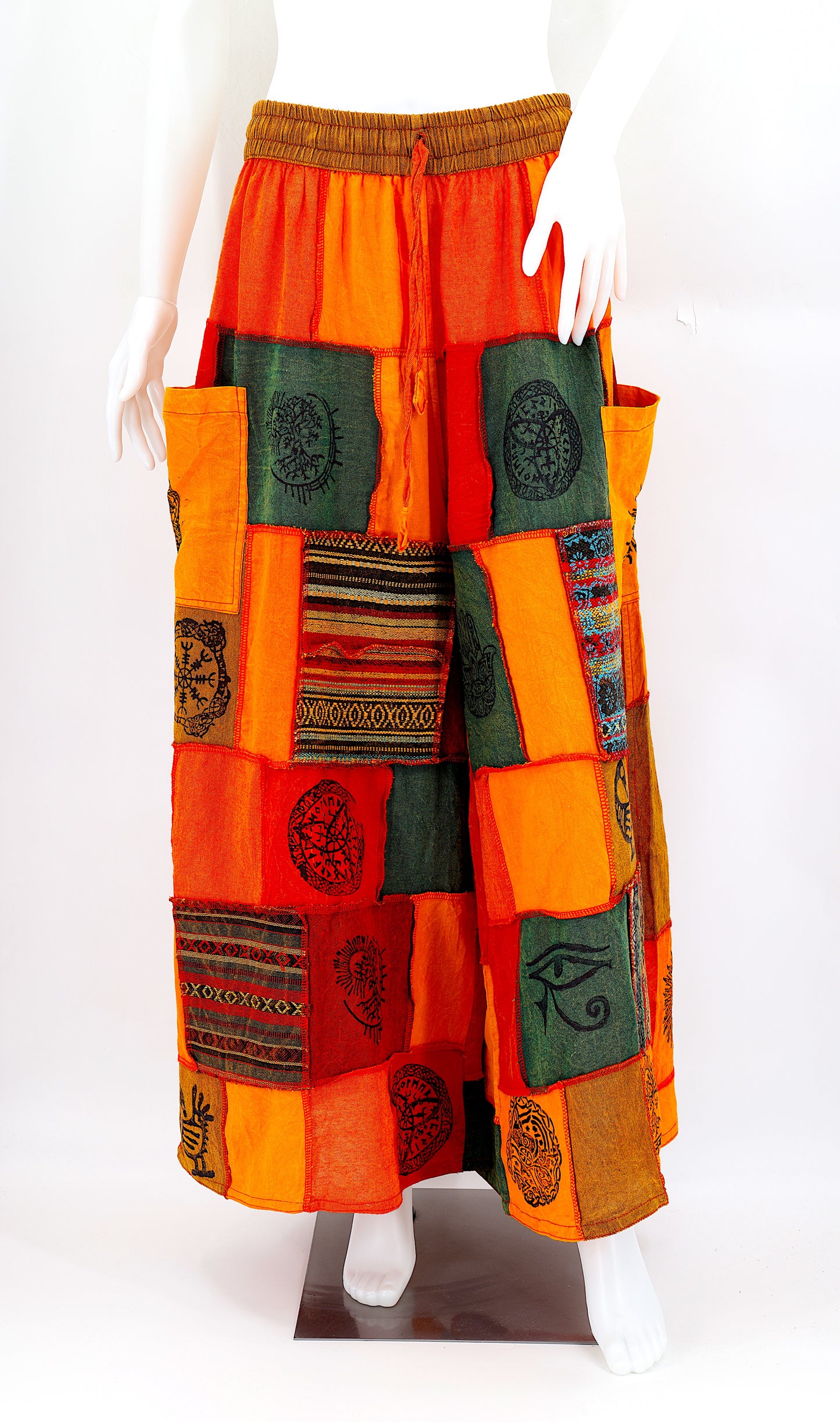 Bohemian harem pants with Old Gods symbolic patchwork and wide-leg design, handmade from natural cotton
