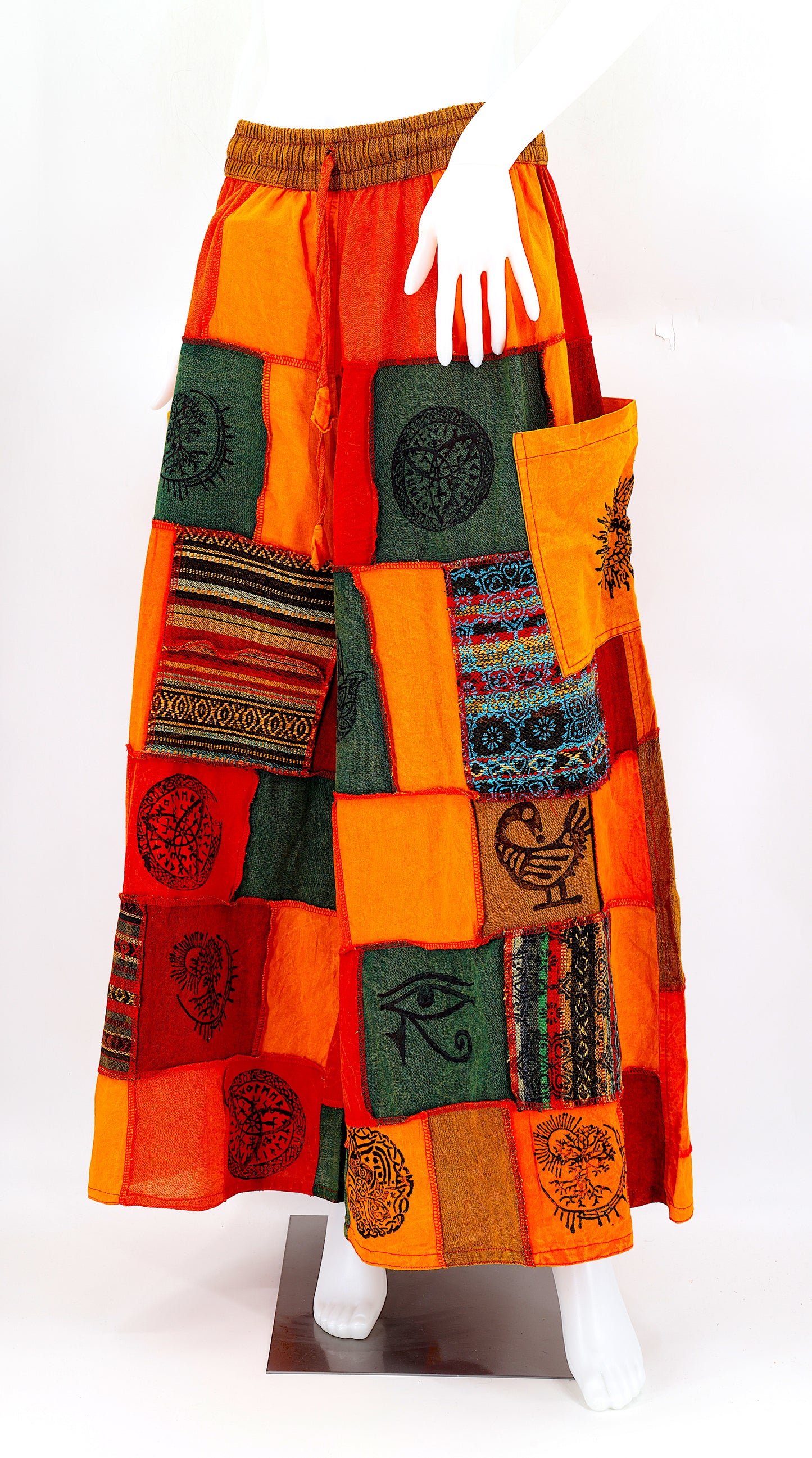 Bohemian harem pants with Old Gods symbolic patchwork and wide-leg design, handmade from natural cotton