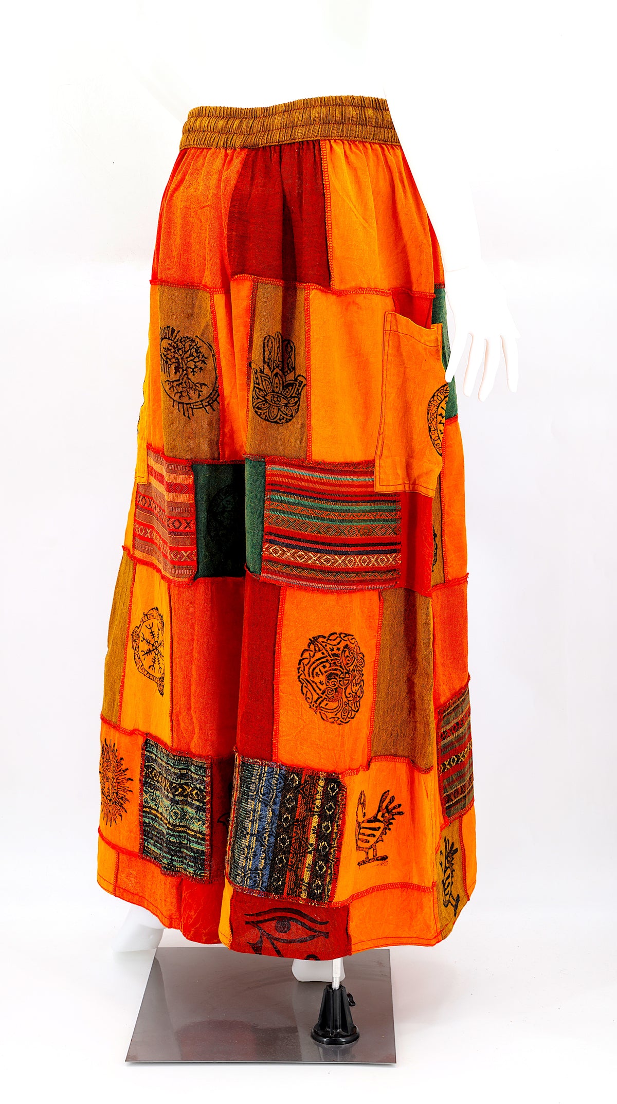 Back view of wide-leg cotton harem pants featuring ancient symbol designs