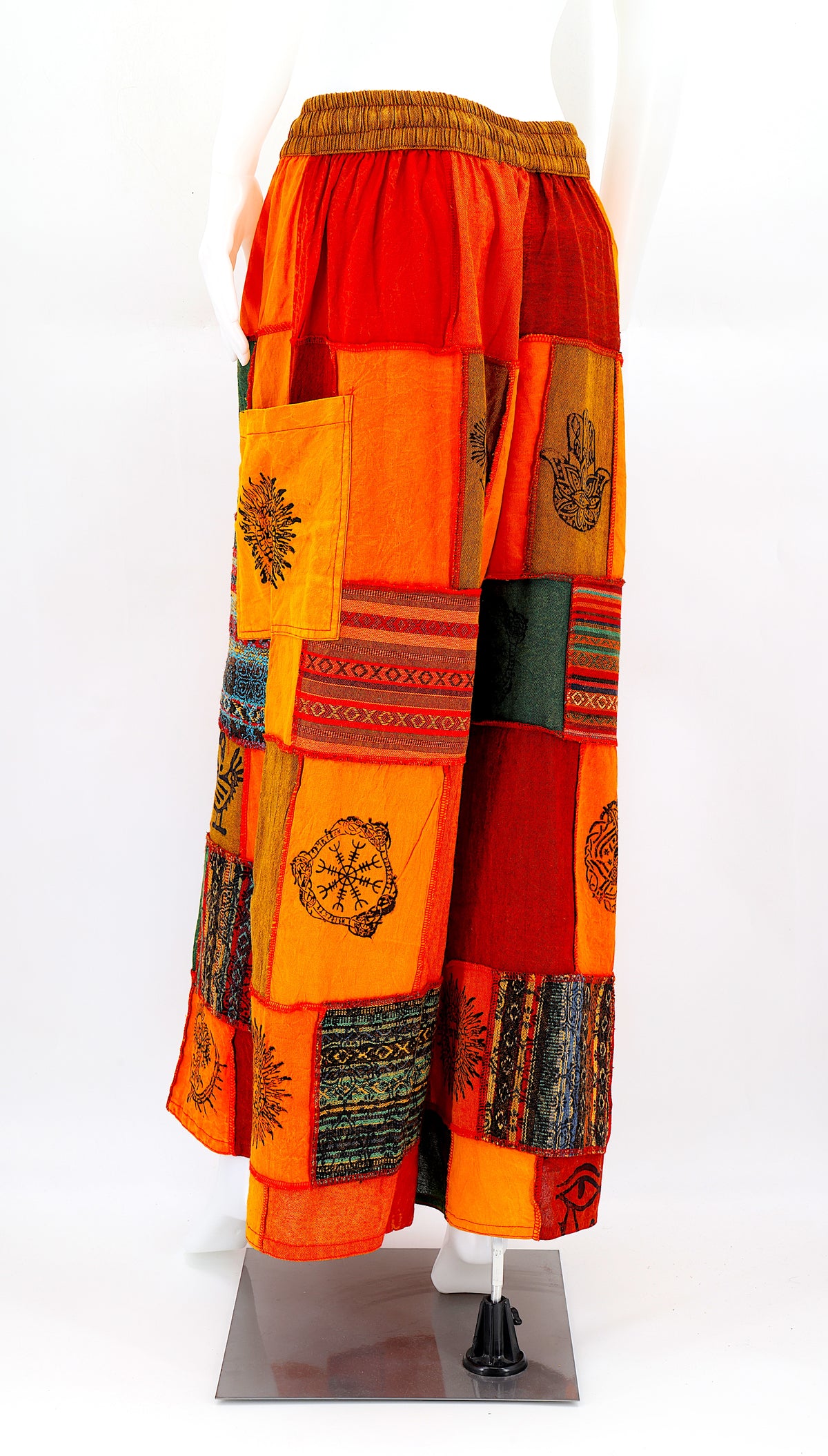 Back view of wide-leg cotton harem pants featuring ancient symbol designs