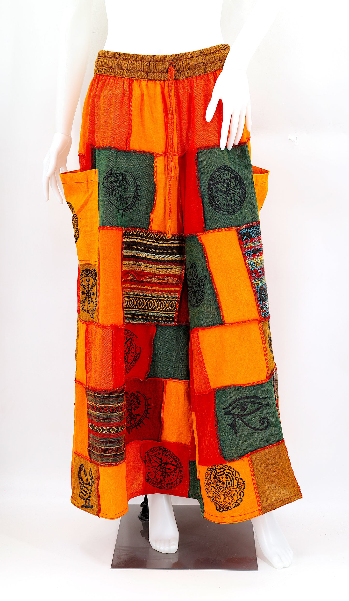 Bohemian harem pants with Old Gods symbolic patchwork and wide-leg design, handmade from natural cotton