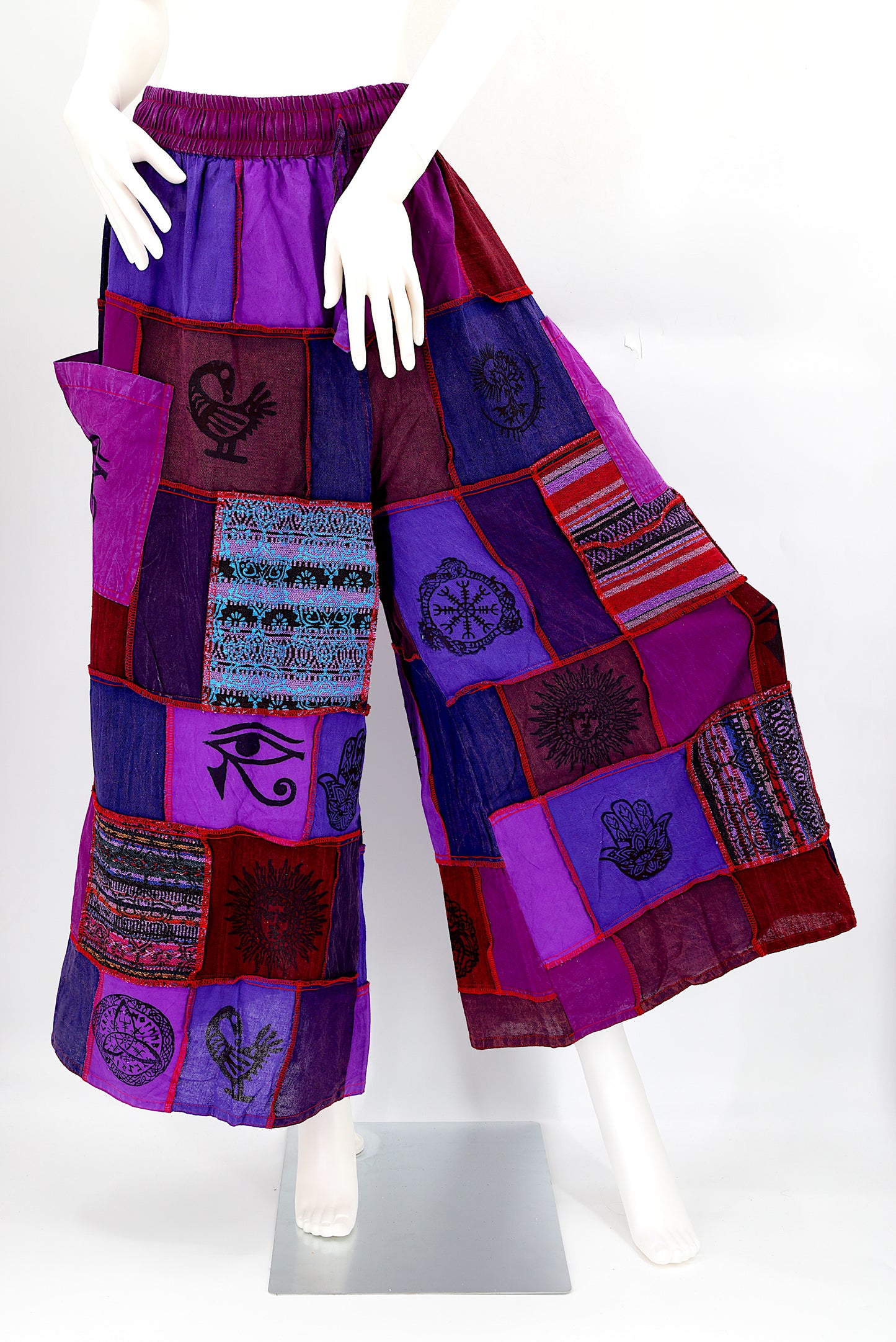 Bohemian harem pants with Old Gods symbolic patchwork and wide-leg design, handmade from natural cotton