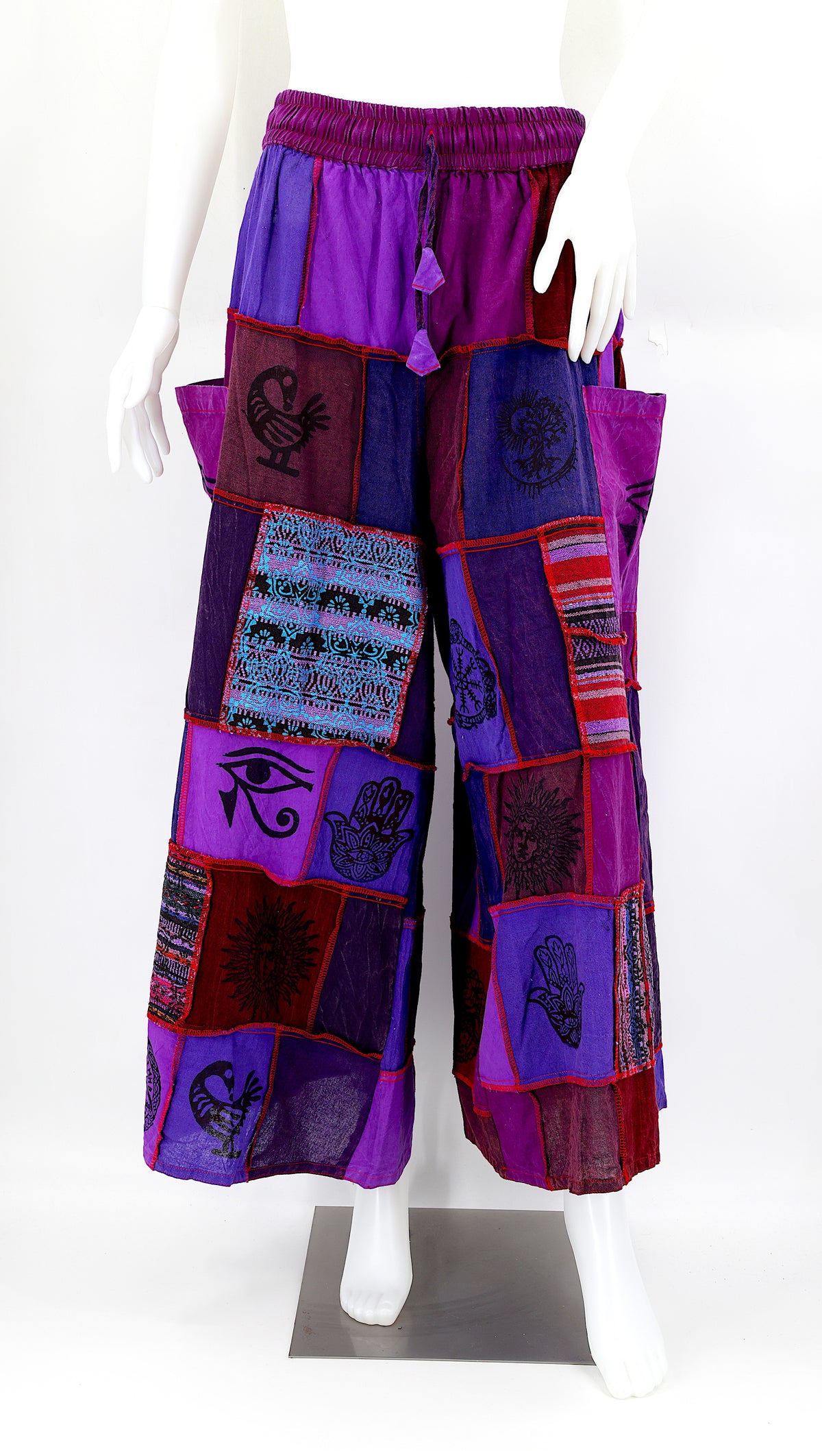 Bohemian harem pants with Old Gods symbolic patchwork and wide-leg design, handmade from natural cotton