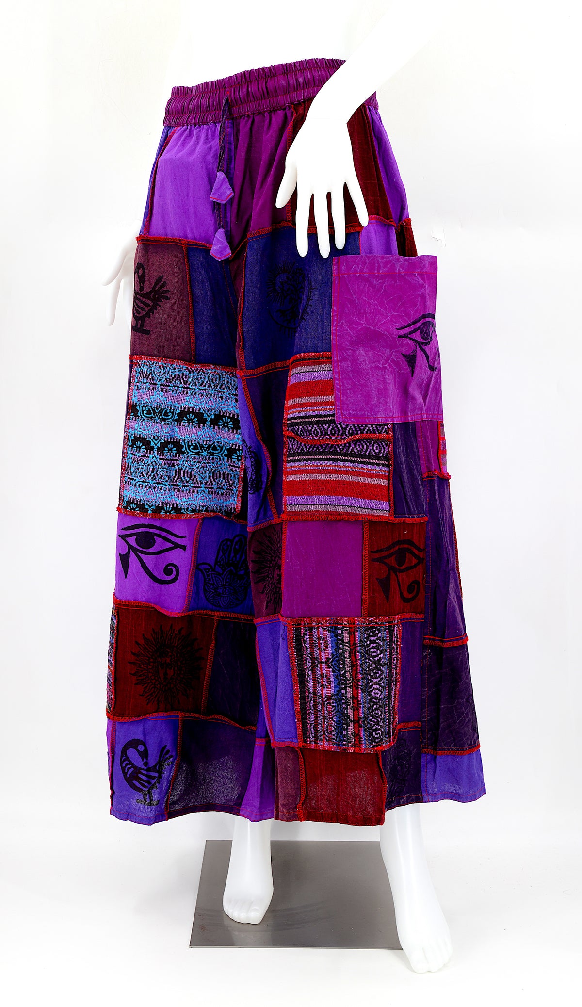 Bohemian harem pants with Old Gods symbolic patchwork and wide-leg design, handmade from natural cotton