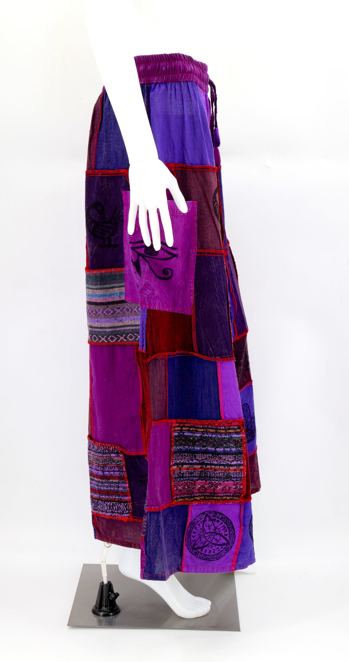 Side profile of hippie-style harem trousers with mystical Old Gods symbols and deep side pockets