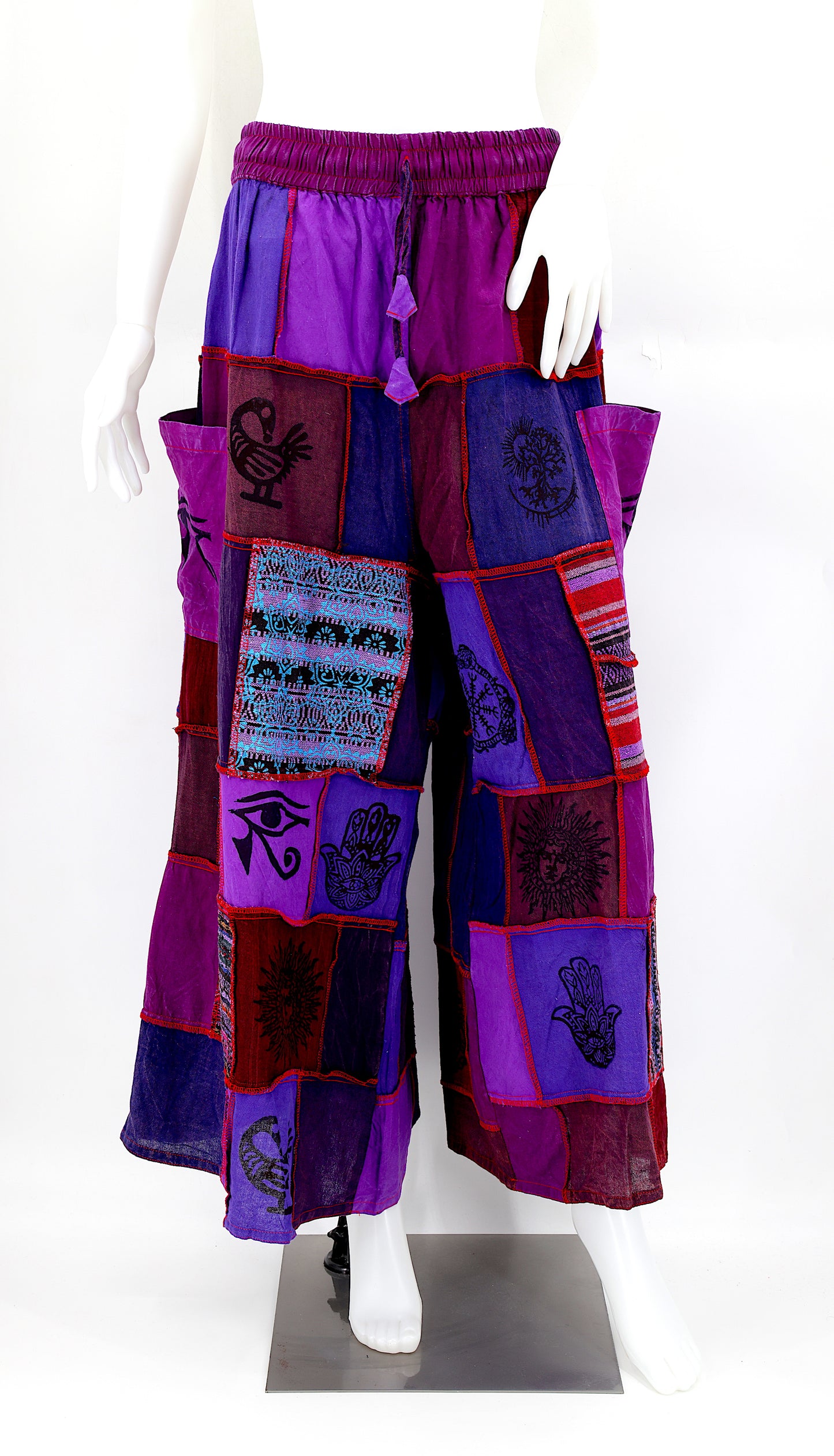 Bohemian harem pants with Old Gods symbolic patchwork and wide-leg design, handmade from natural cotton